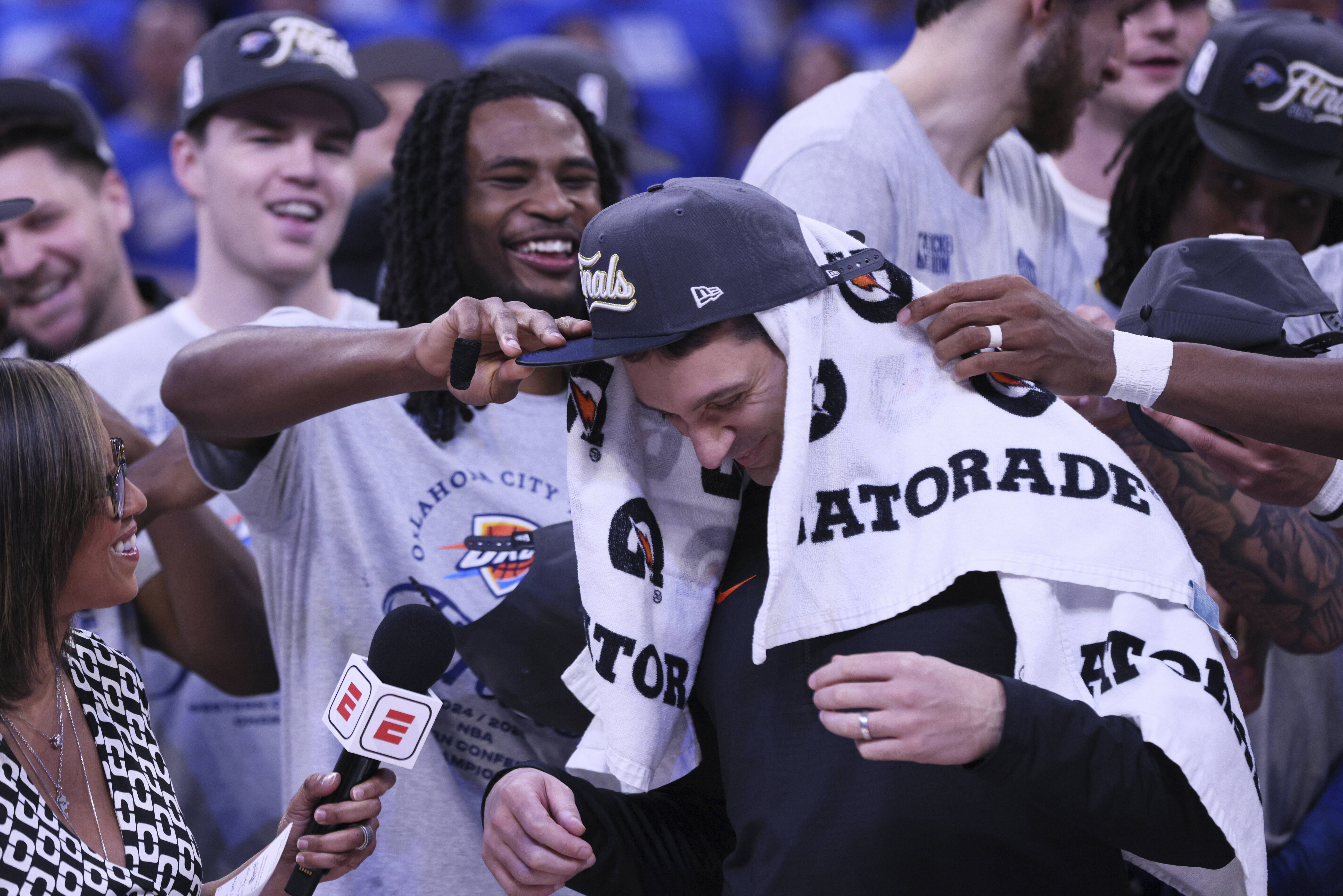 Oklahoma City Thunder head coach Mark Daigneault celebrates with his team after Game 5 of the Western Conference finals of the NBA basketball playoffs against the Minnesota Timberwolves, Wednesday, May 28, 2025, in Oklahoma City. 