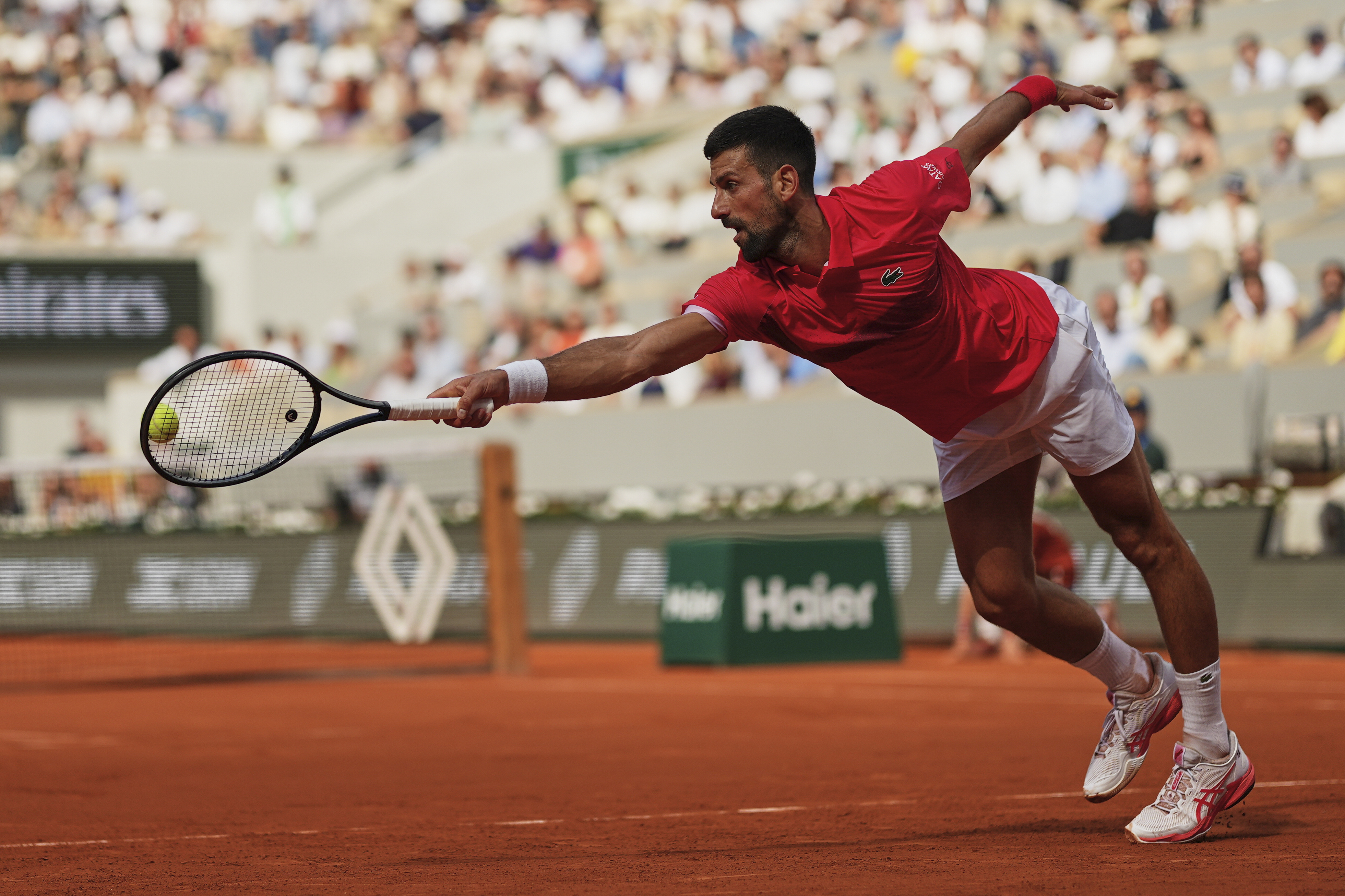 Serbia's Novak Djokovic plays a shot against Britain's Cameron Norrie during their fourth round match of the French Tennis Open at the Roland-Garros stadium in Paris, Monday, June 2, 2025. 