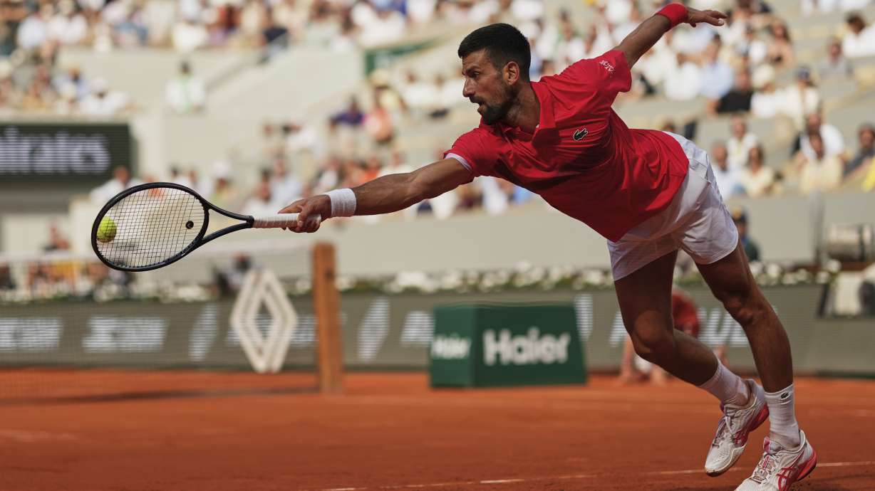 Serbia's Novak Djokovic plays a shot against Britain's Cameron Norrie during their fourth round match of the French Tennis Open at the Roland-Garros stadium in Paris, Monday, June 2, 2025.