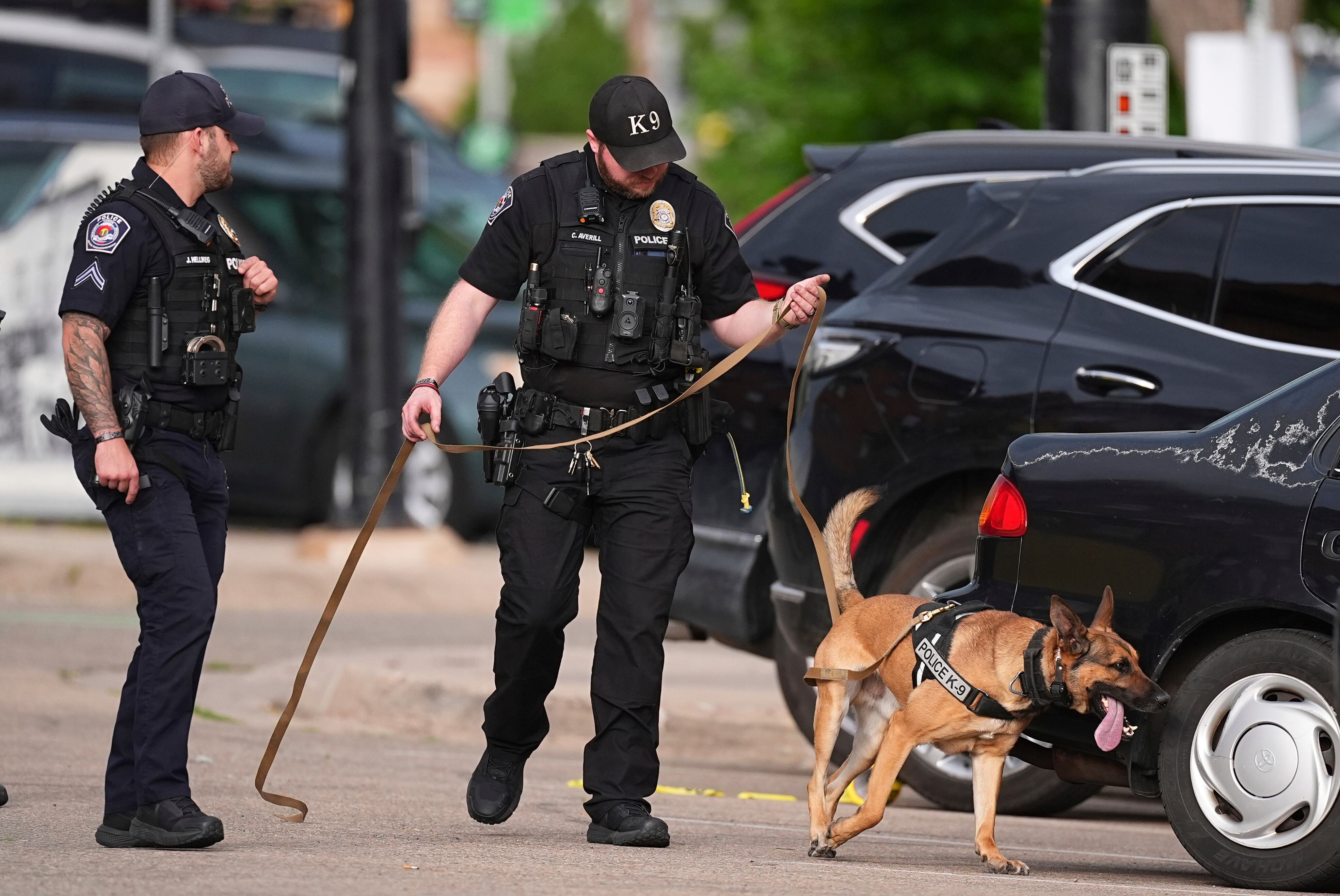Law enforcement officials investigate after an attack on the Pearl Street Mall on Sunday in Boulder, Colorado.