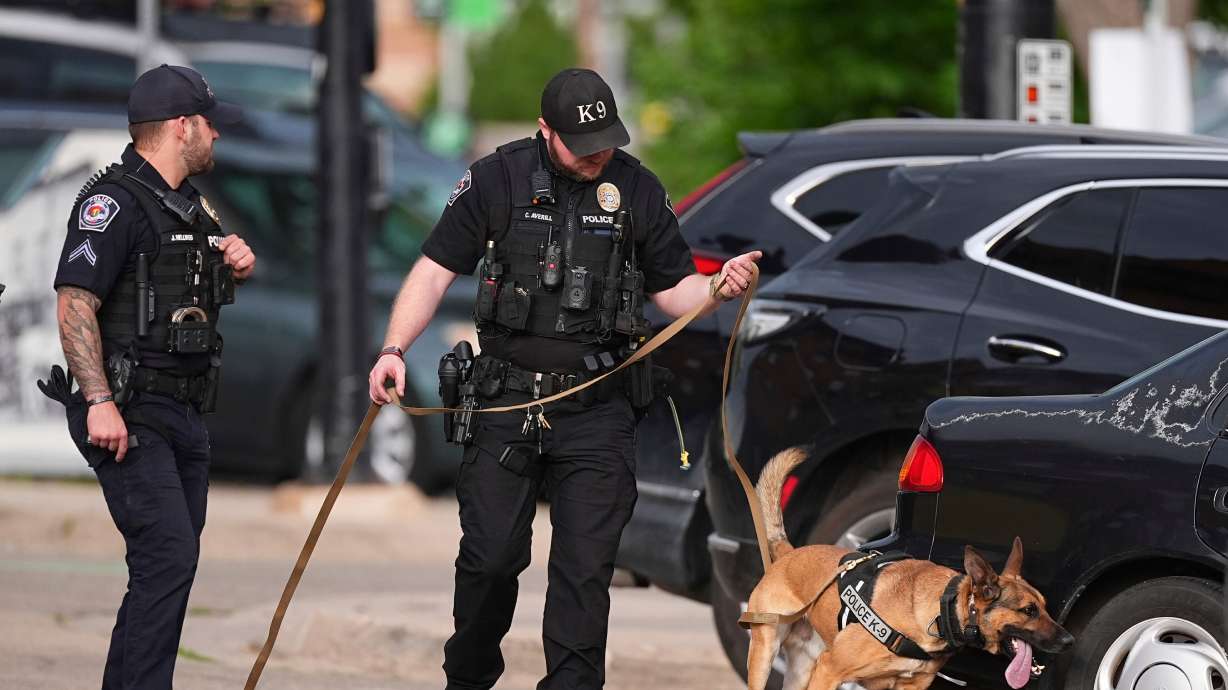 Law enforcement officials investigate after an attack on the Pearl Street Mall on Sunday in Boulder, Colorado.