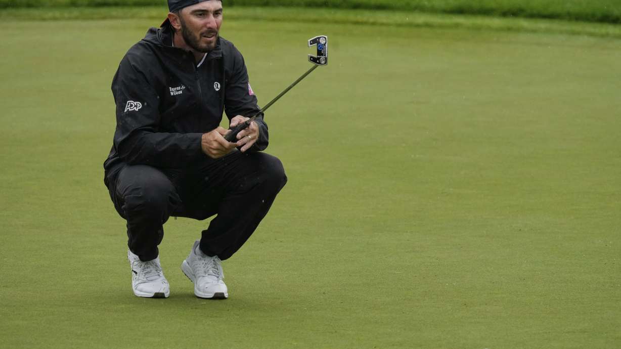 Max Homa lines up his putt on the 13th green during the second round of the Memorial golf tournament, Friday, May 30, 2025, in Dublin, Ohio.