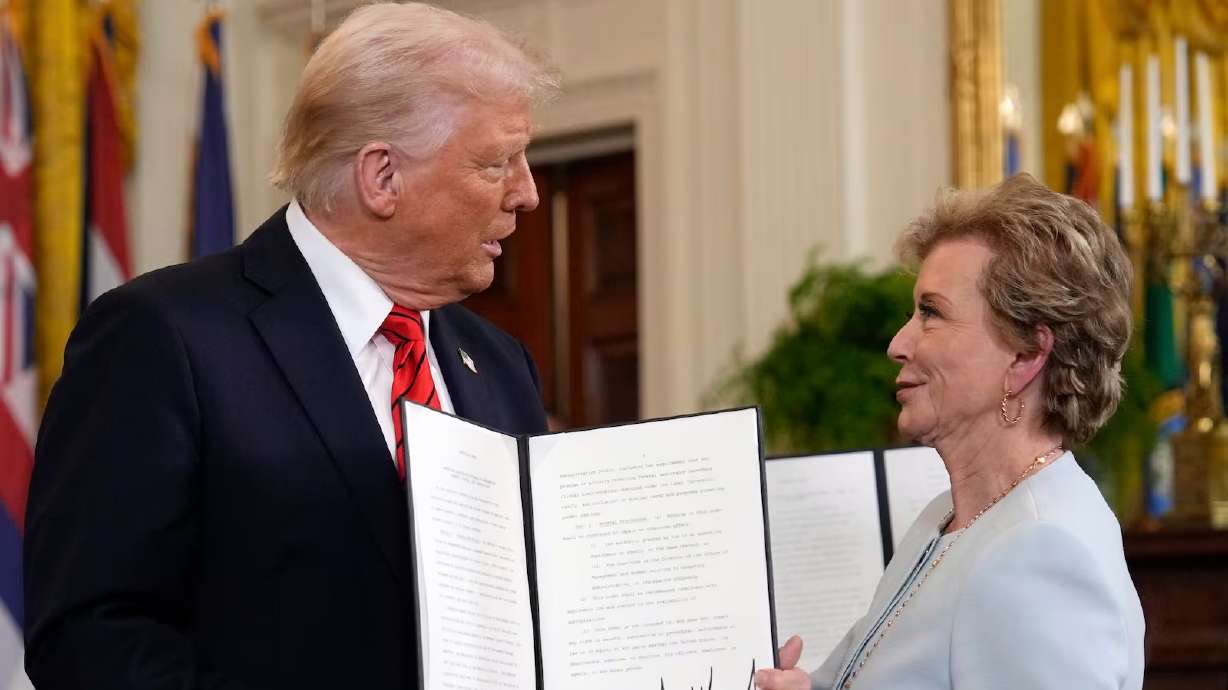 President Donald Trump stands alongside Secretary of Education Linda McMahon at the White House in Washington, March 20. Now the Trump administration is articulating its specific Department of Education fiscal intentions.