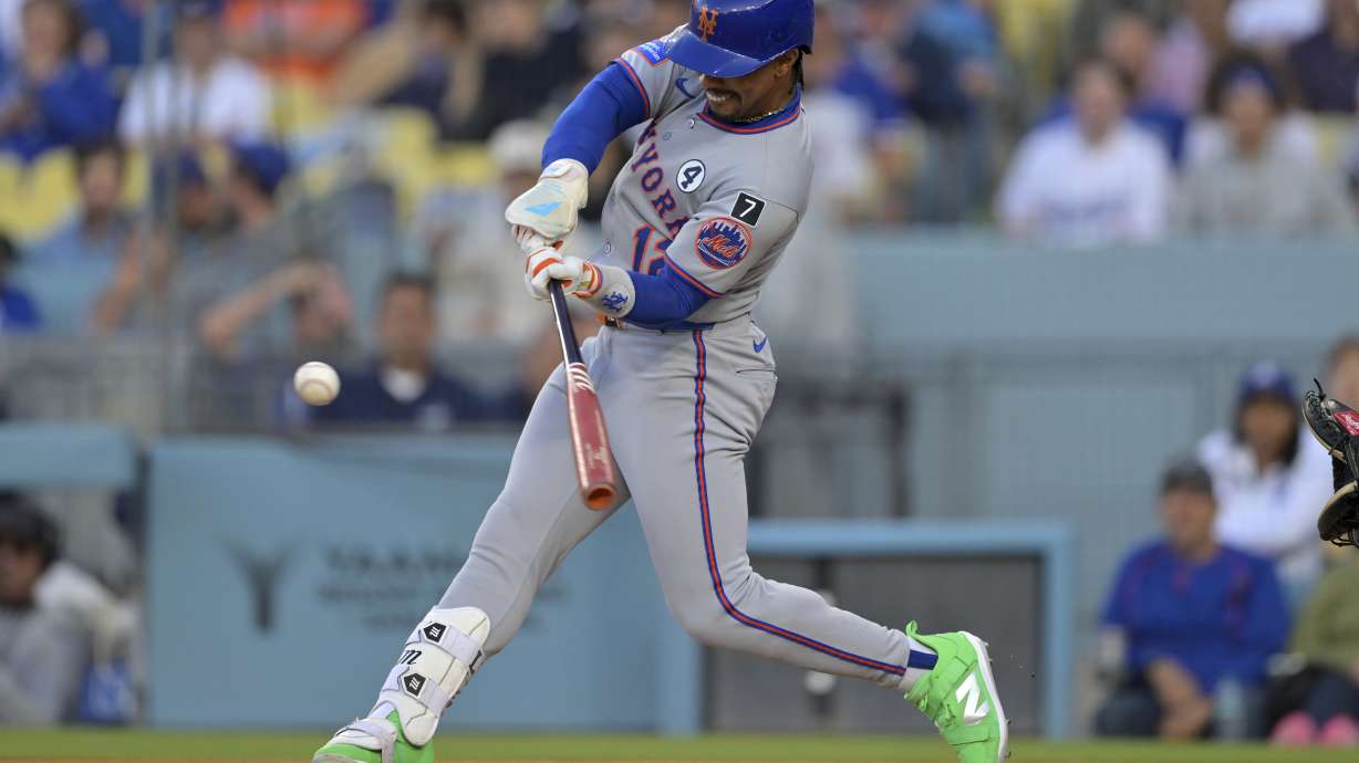 New York Mets' Francisco Lindor hits a solo home run in the first inning of a baseball game against the Los Angeles Dodgers, Monday, June 2, 2025, in Los Angeles.