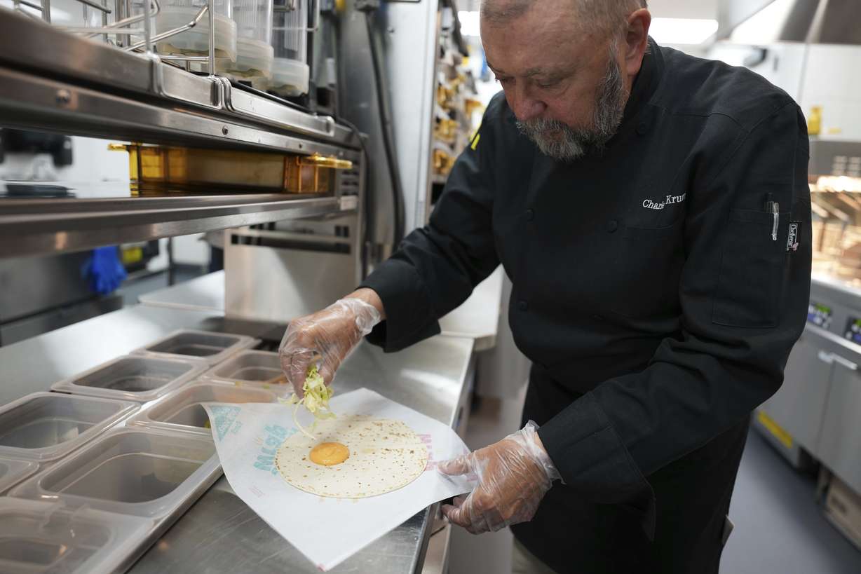 Charles L. Krumsiek, a McDonald's chef, makes a Snack Wrap (ranch) at McDonald's Headquarter in Chicago, Thursday. McDonald's is bringing back the Snack Wrap to U.S. markets.