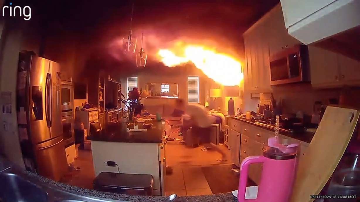 A fire inside the Burgoyne family’s home in South Jordan is shown on May 11. Firefighters suspect it was caused by a lithium battery.