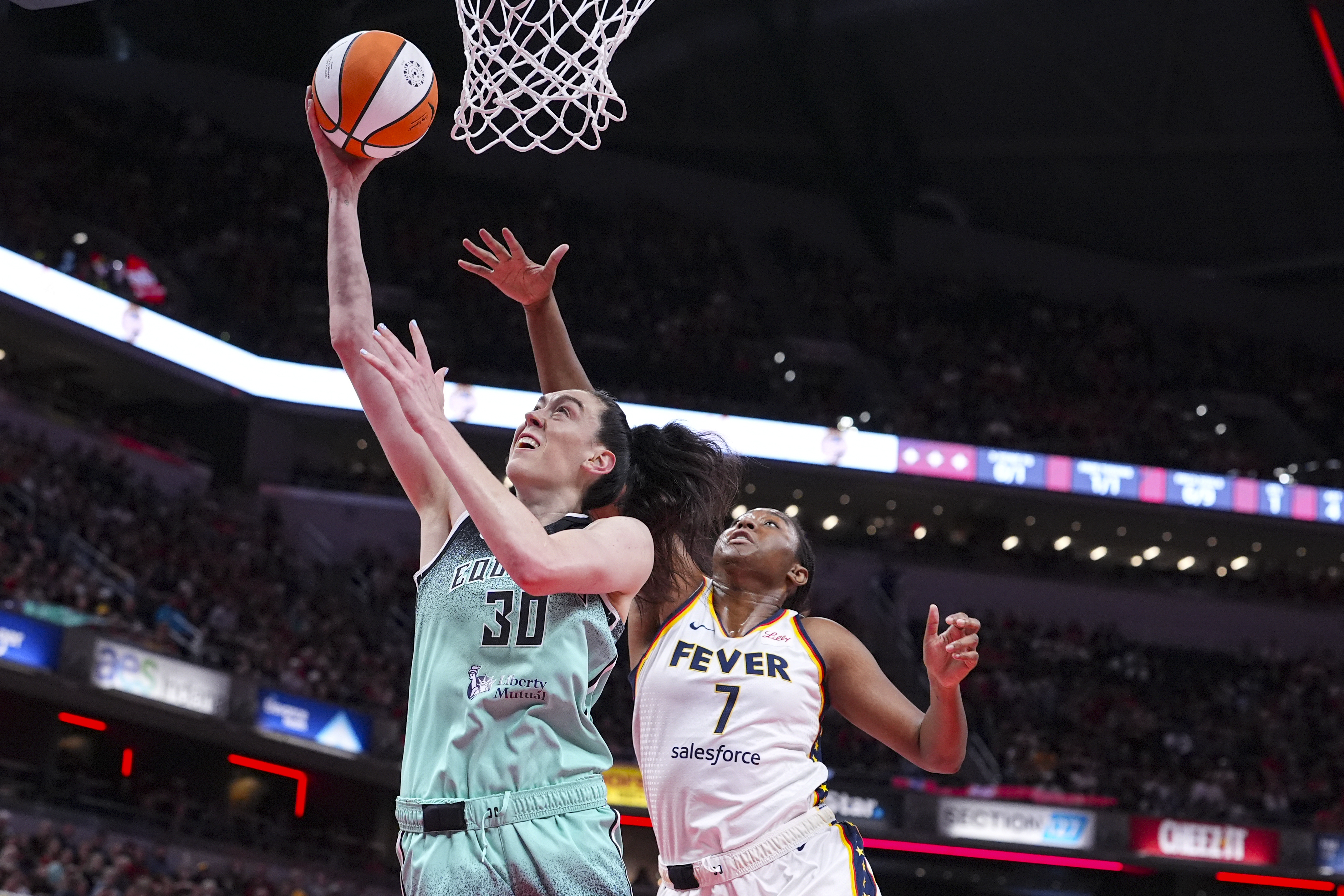 New York Liberty forward Breanna Stewart (30) shoots in front of Indiana Fever forward Aliyah Boston (7) in the first half of a WNBA basketball game in Indianapolis, Saturday, May 24, 2025. 