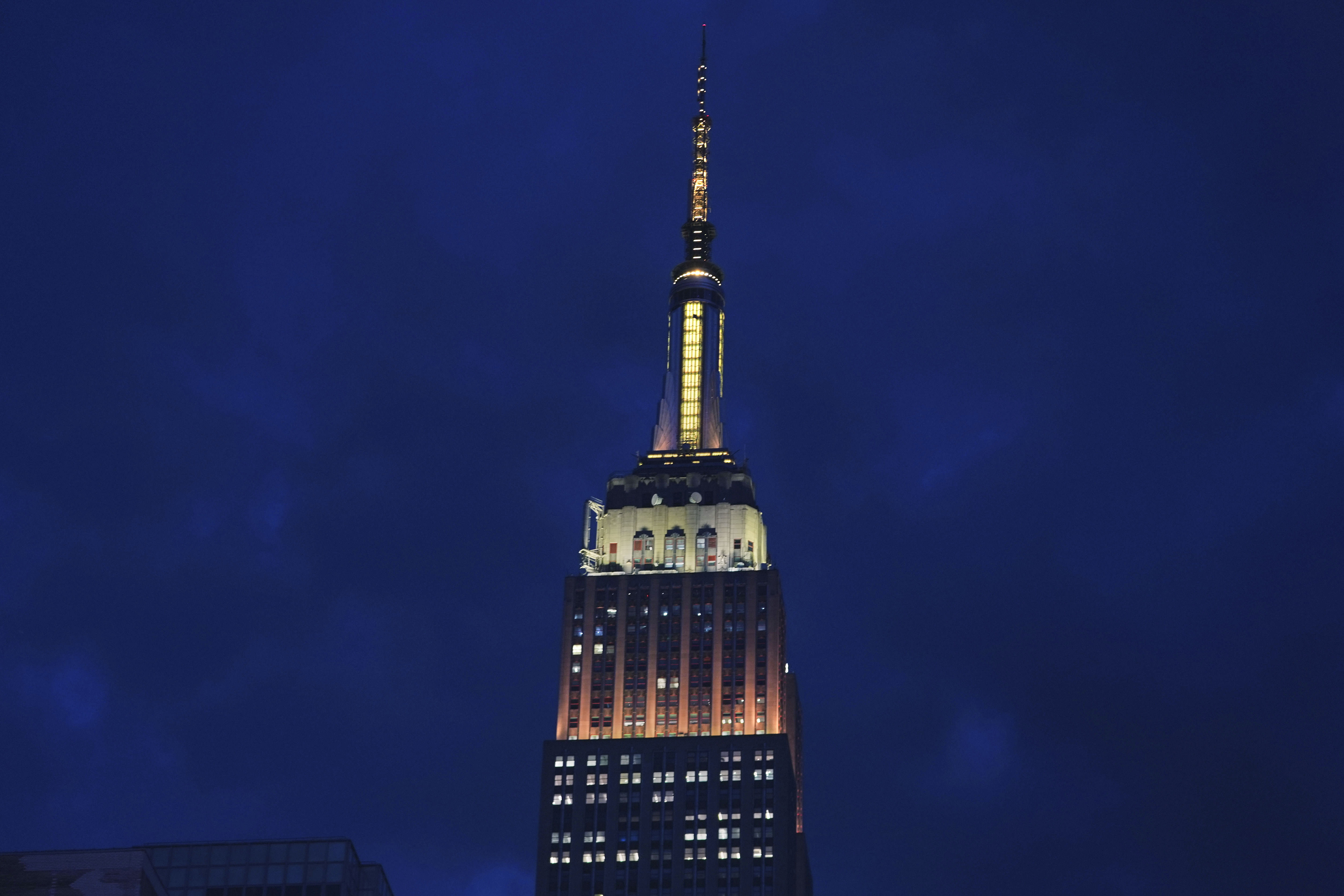 The Empire State Building is lit in gold and white in honor of Pope Leo XIV Thursday, May 8, 2025, in New York. 