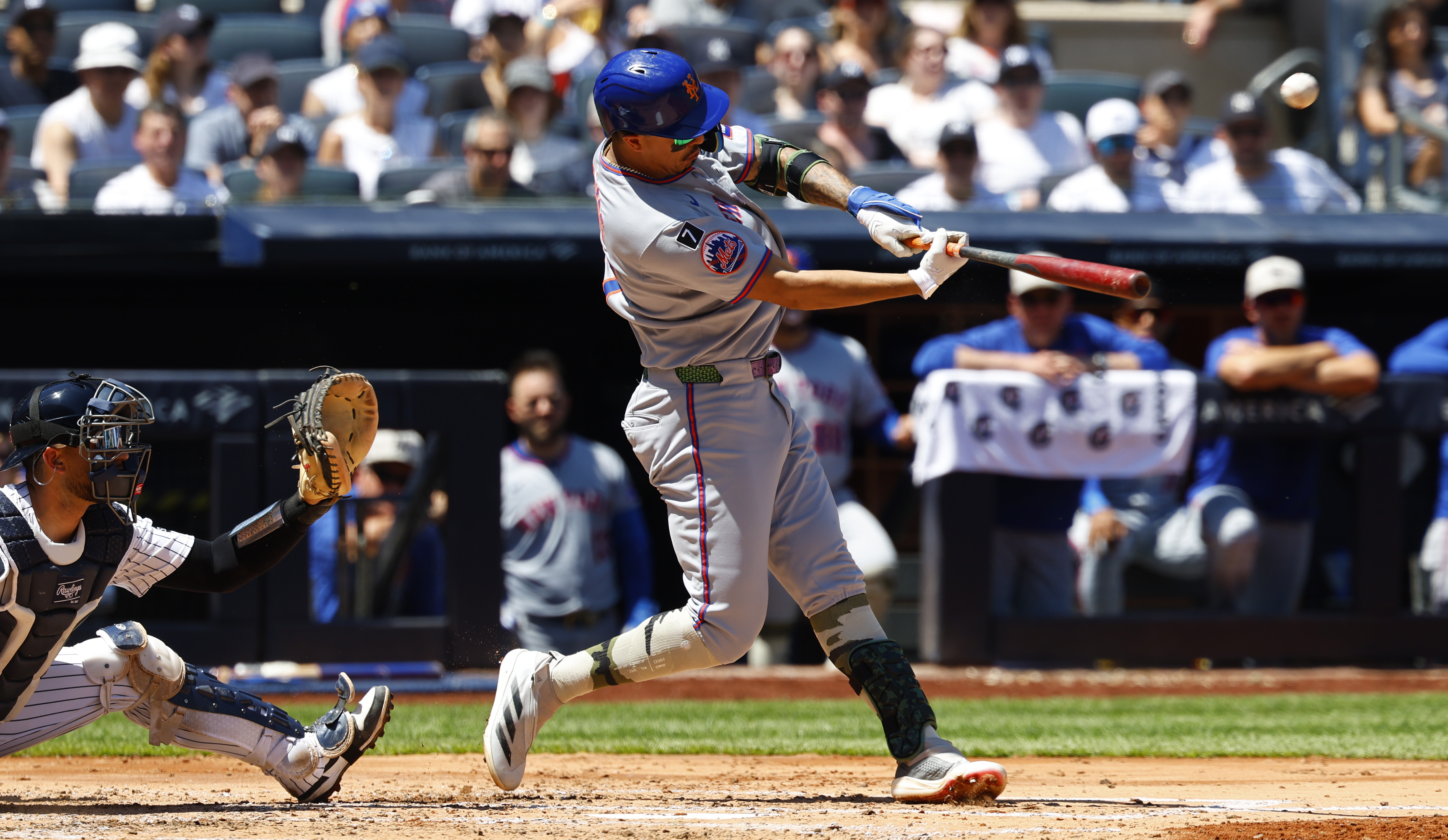 New York Mets' Mark Vientos (27) hits a sacrifice fly that that scored Juan Soto during the fourth inning of a baseball game against the New York Yankees, Saturday, May 17, 2025, in New York.