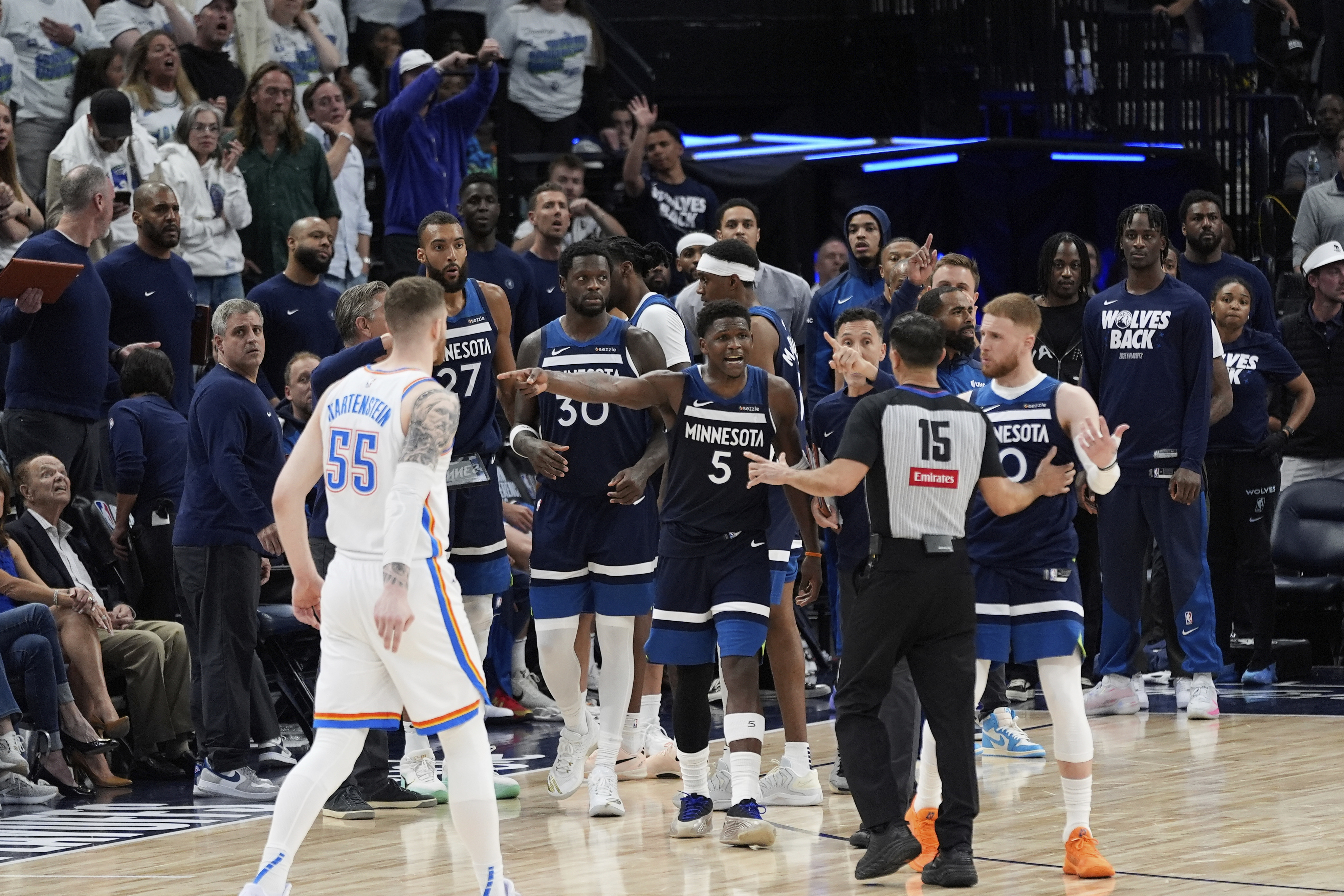 Minnesota Timberwolves guard Anthony Edwards (5) and teammates react toward referee Zach Zarba (15) during the final seconds of the second half of Game 4 of the Western Conference finals of the NBA basketball playoffs against the Oklahoma City Thunder Monday, May 26, 2025, in Minneapolis.