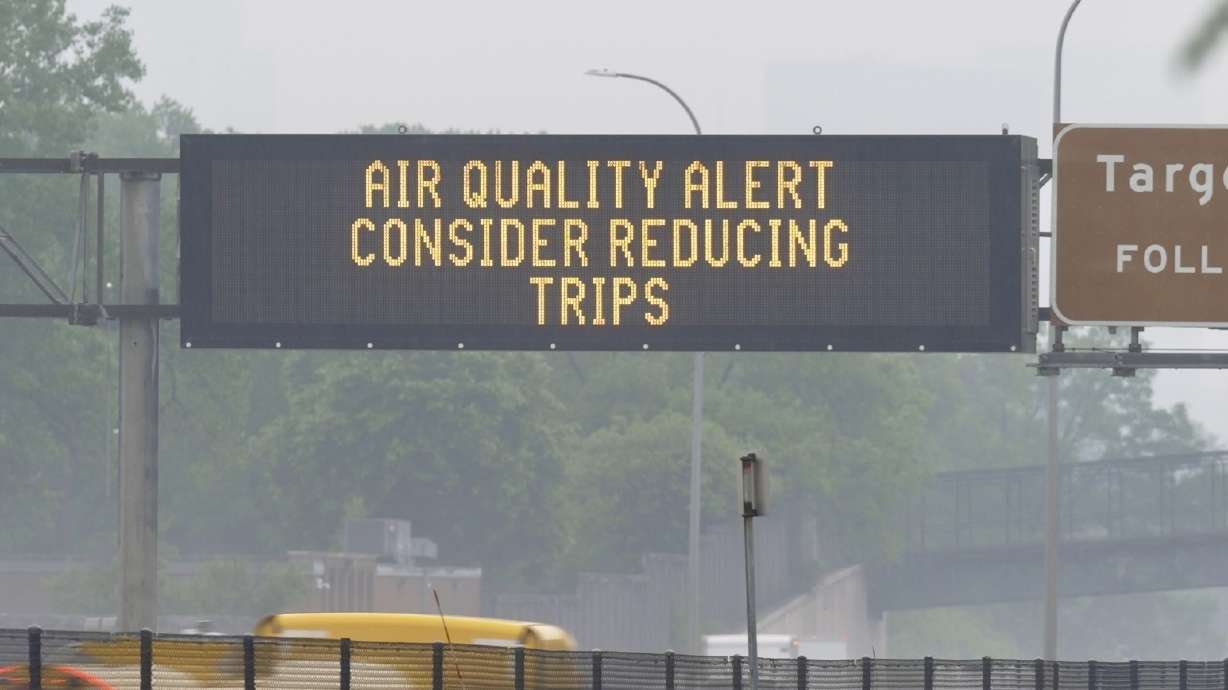 A sign warns of an air quality alert in Minneapolis, Minn., on Tuesday. Smoke from Canadian wildfires created another day of poor air quality in the Midwest, including parts of Minnesota.