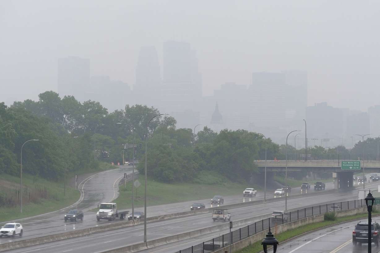 Smoke from Canadian wildfires and rain obscures the downtown skyline of Minneapolis, Minn., on Tuesday. The Twin Cities area was the most affected in the Midwest by smoke.