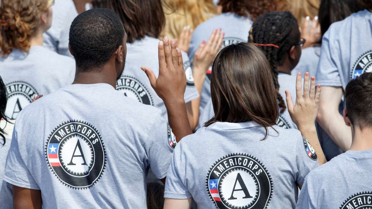 AmeriCorps volunteers are sworn in for duty at a ceremony, Sept. 12, 2014, on the South Lawn of the White House in Washington. The House will vote on a slew of spending cuts as early as next week, a source confirms.