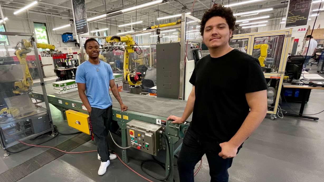 Clearfield Job Corps students Nike Reifenberger, right, and Deon Thomas at a robotics and automation classroom at Davis Technical College in Kaysville on Tuesday.