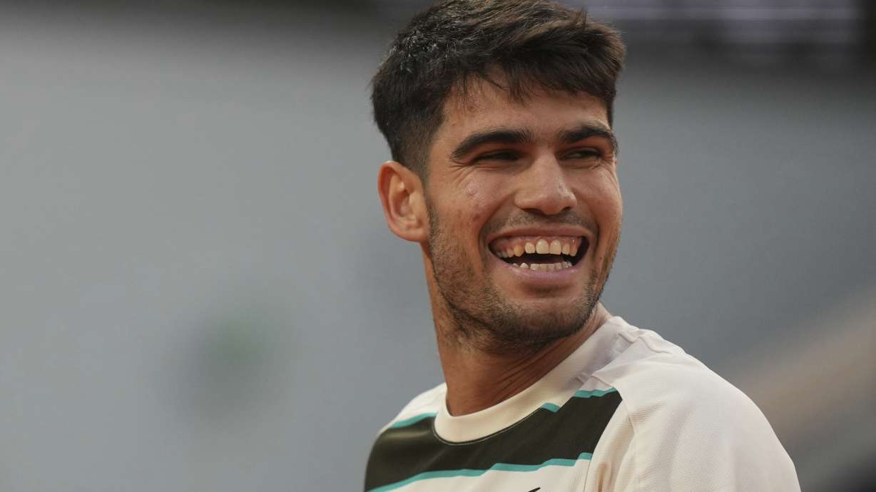 Spain's Carlos Alcaraz smiles as he plays against Tommy Paul of the U.S. during their quarterfinal match of the French Tennis Open at the Roland-Garros stadium in Paris, Tuesday, June 3, 2025.