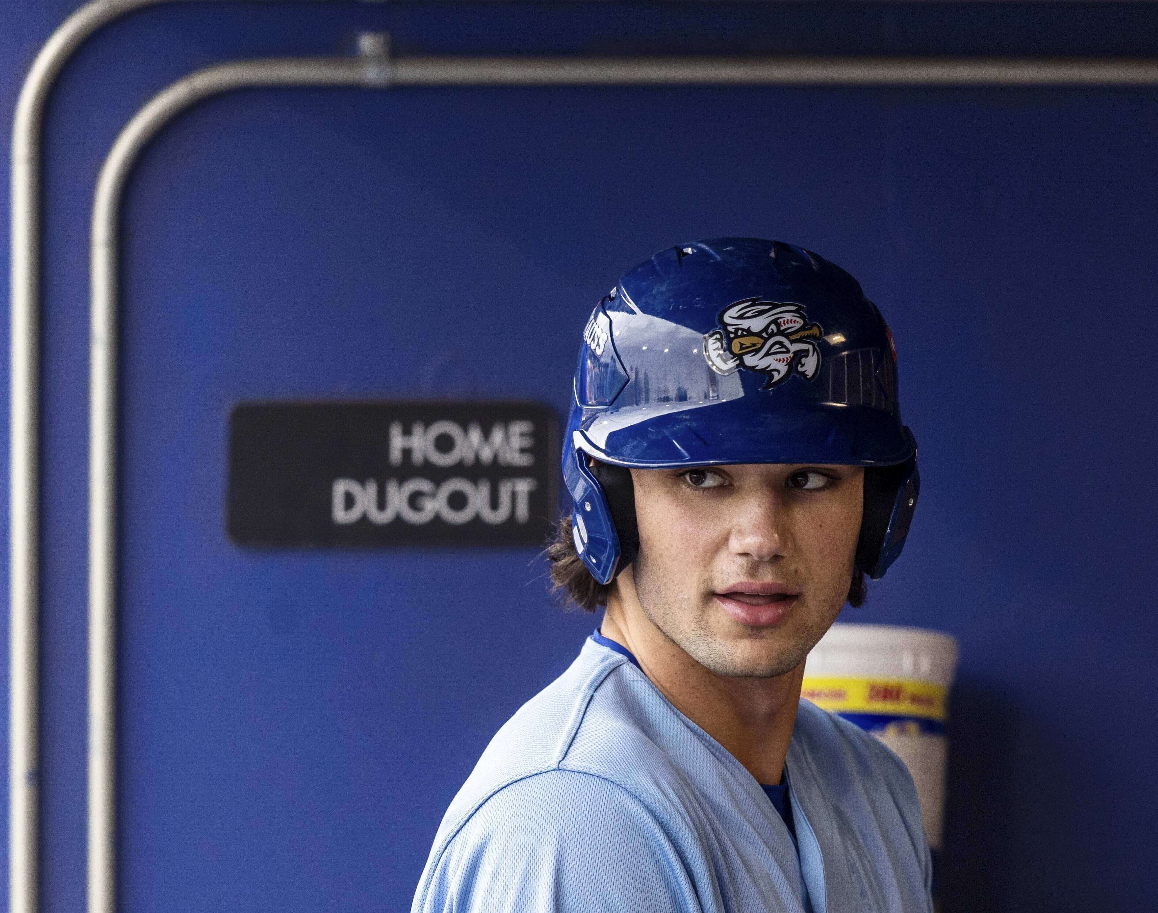 FILE - The Omaha Storm Chasers' Jac Caglianone waits in the dugout before his at-bat in a minor league baseball game against St. Paul at Werner Park in Papillion, Neb. on May 27, 2025. 