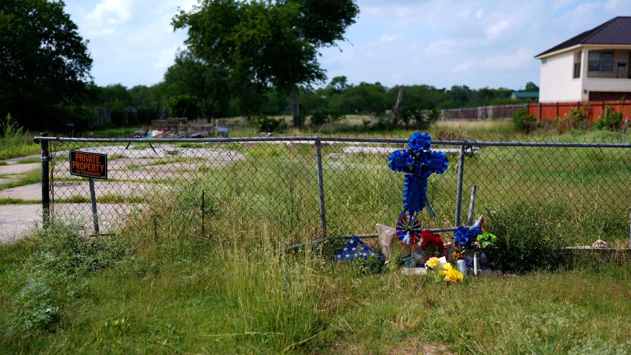 Candles, flowers and notes are left at a make-shift memorial for voice actor Jonathan Joss, who was recently killed, Tuesday in San Antonio.