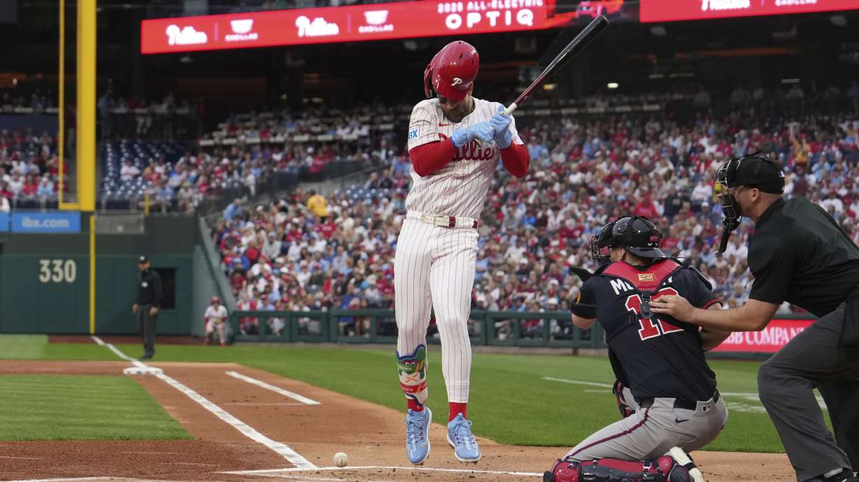 FILE - Philadelphia Phillies' Bryce Harper is hit by a pitch Atlanta Braves' Spencer Strider during a baseball game, Tuesday, May 27, 2025, in Philadelphia.