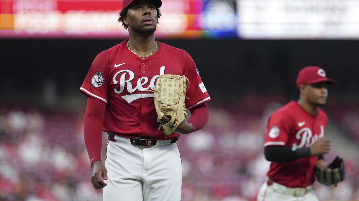 Cincinnati Reds' Hunter Greene walks to the dugout in the fifth inning of a baseball game against the Milwaukee Brewers, Tuesday, June 3, 2025, in Cincinnati.