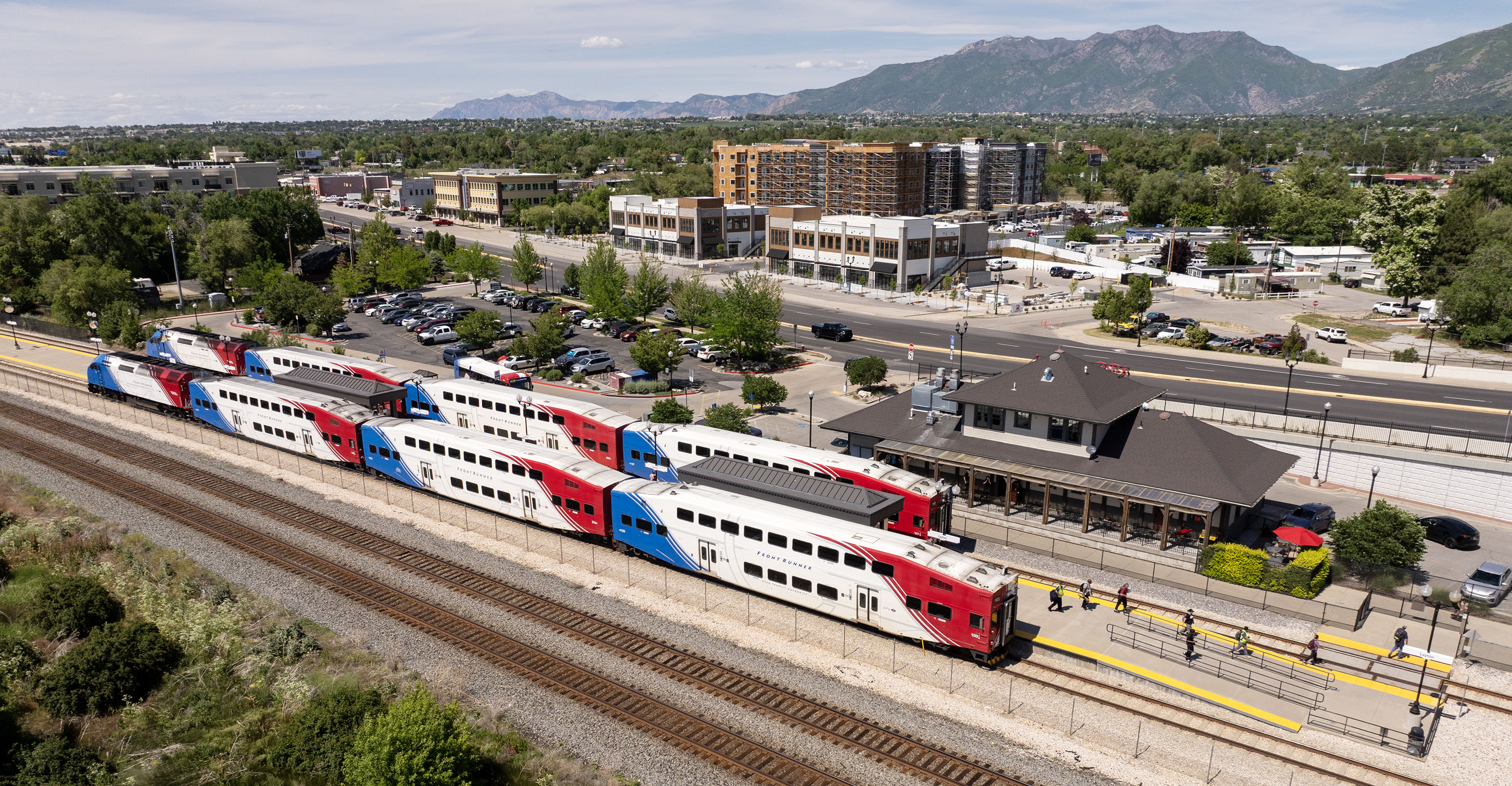 Two FrontRunner trains begin exiting the Layton Station on Main Street on Tuesday. Layton officials have approved a development plan for the area around the station.