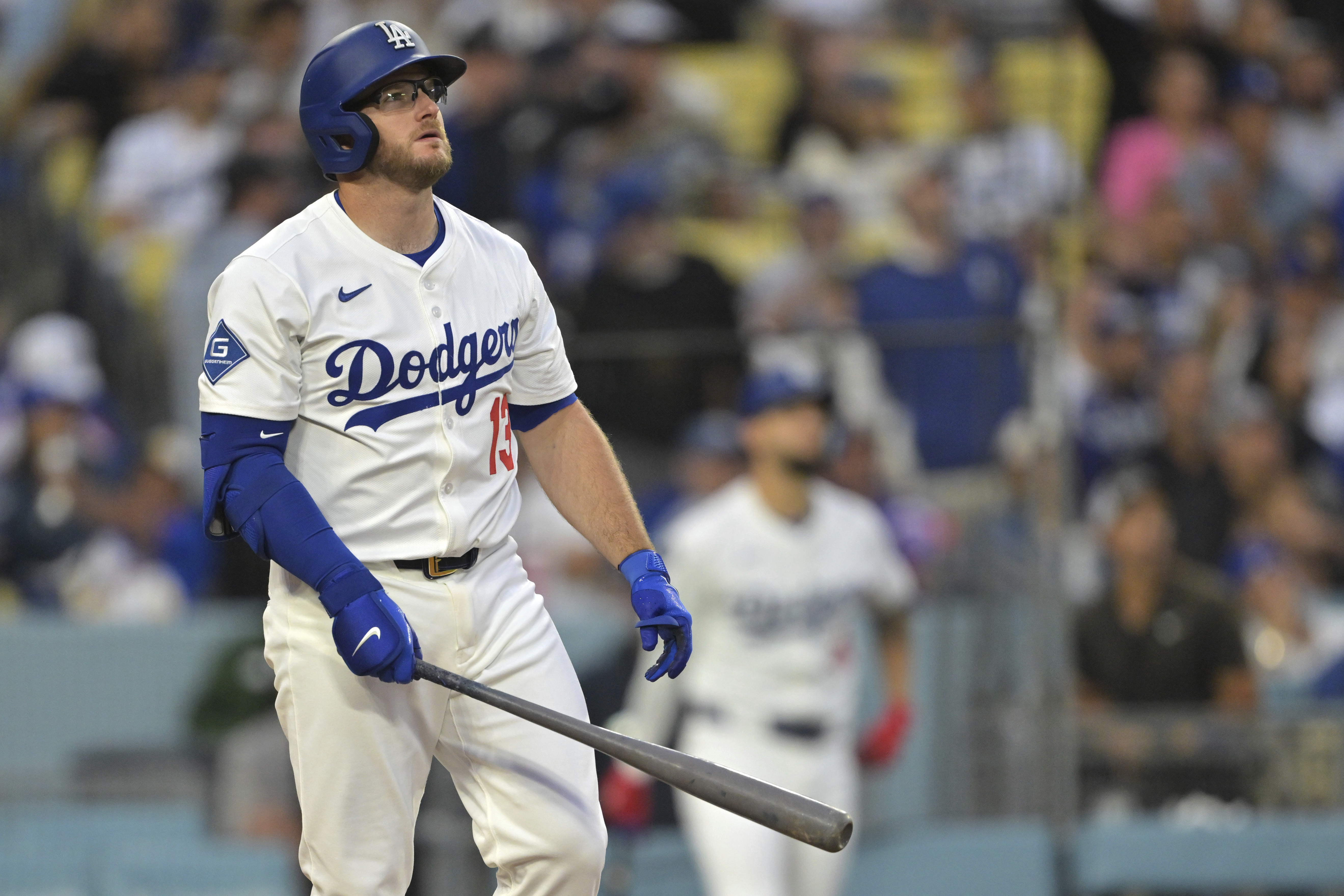 Los Angeles Dodgers' Max Muncy watches the flight of the ball on a two-run home run during the first inning of a baseball game against the New York Mets, Tuesday, June 3, 2025, in Los Angeles. 
