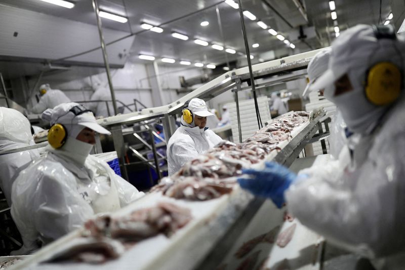 Workers process hake at a Chilean fishing company in Talcahuano, Chile, May 20. Global trade tensions could disrupt ocean goods trade and will push up the price of seafood in the U.S., according to a report from the United Nations trade agency on Wednesday.