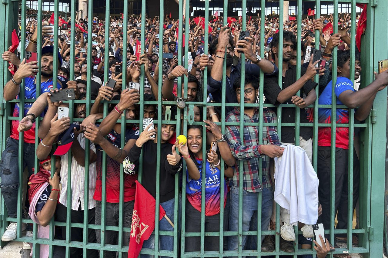 Fans gather to celebrate Royal Challengers Bengaluru cricketers, winners of the Indian Premier League, at the M. Chinnaswamy Stadium in Bengaluru, India, Wednesday, June 4, 2025. 