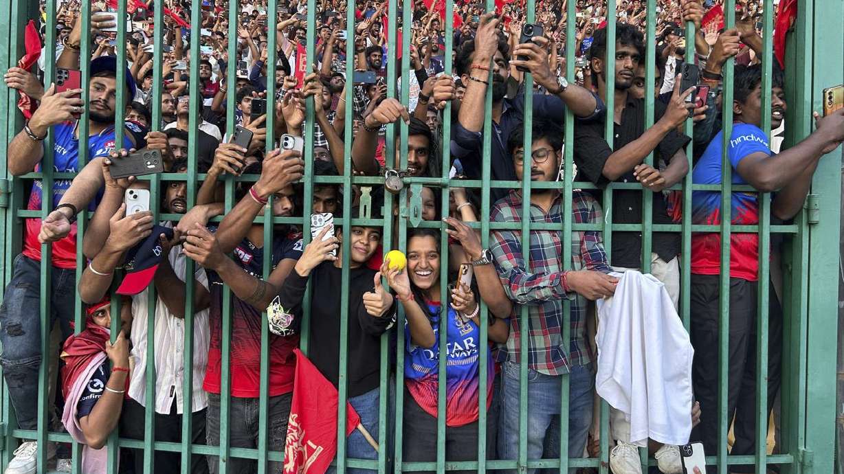 Fans gather to celebrate Royal Challengers Bengaluru cricketers, winners of the Indian Premier League, at the M. Chinnaswamy Stadium in Bengaluru, India, Wednesday, June 4, 2025.