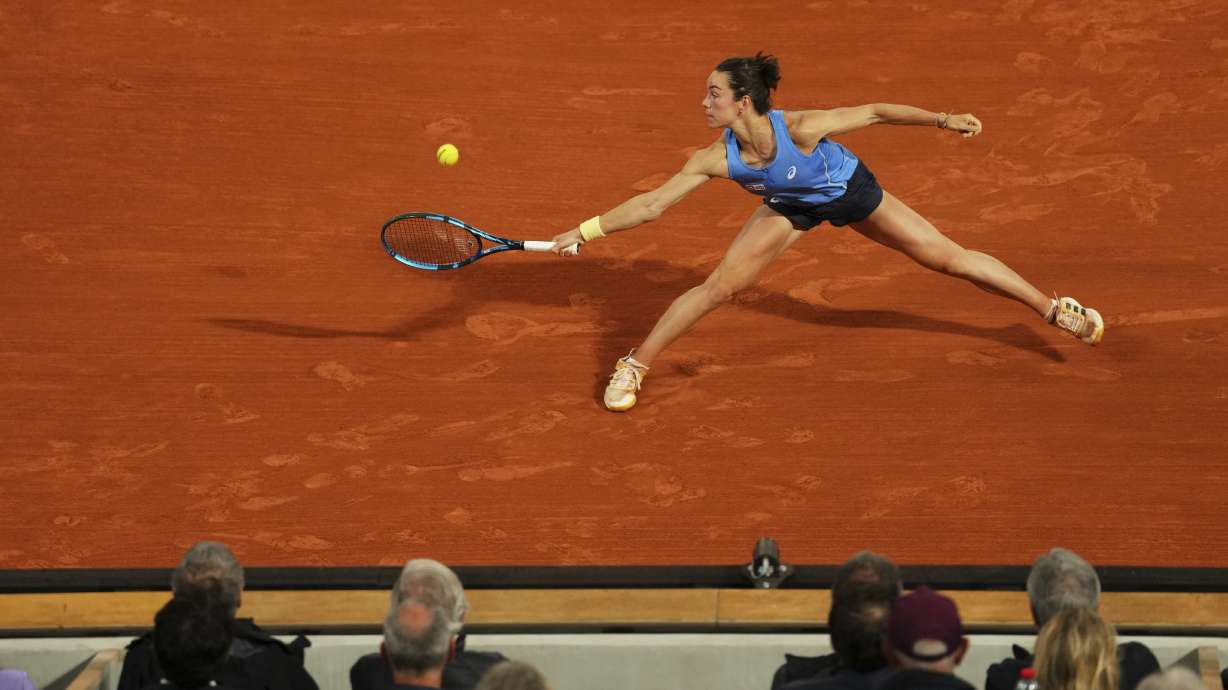France's Lois Boisson plays a shot against Russia's Mirra Andreeva during their quarterfinal match of the French Tennis Open at the Roland-Garros stadium in Paris, Wednesday, June 4, 2025.
