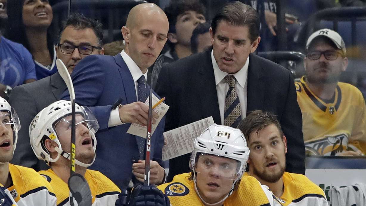FILE - Nashville Predators head coach Peter Laviolette, right, and assistant coach Dan Muse during the third period of an NHL hockey game against the Tampa Bay Lightning, Oct. 26, 2019, in Tampa, Fla.