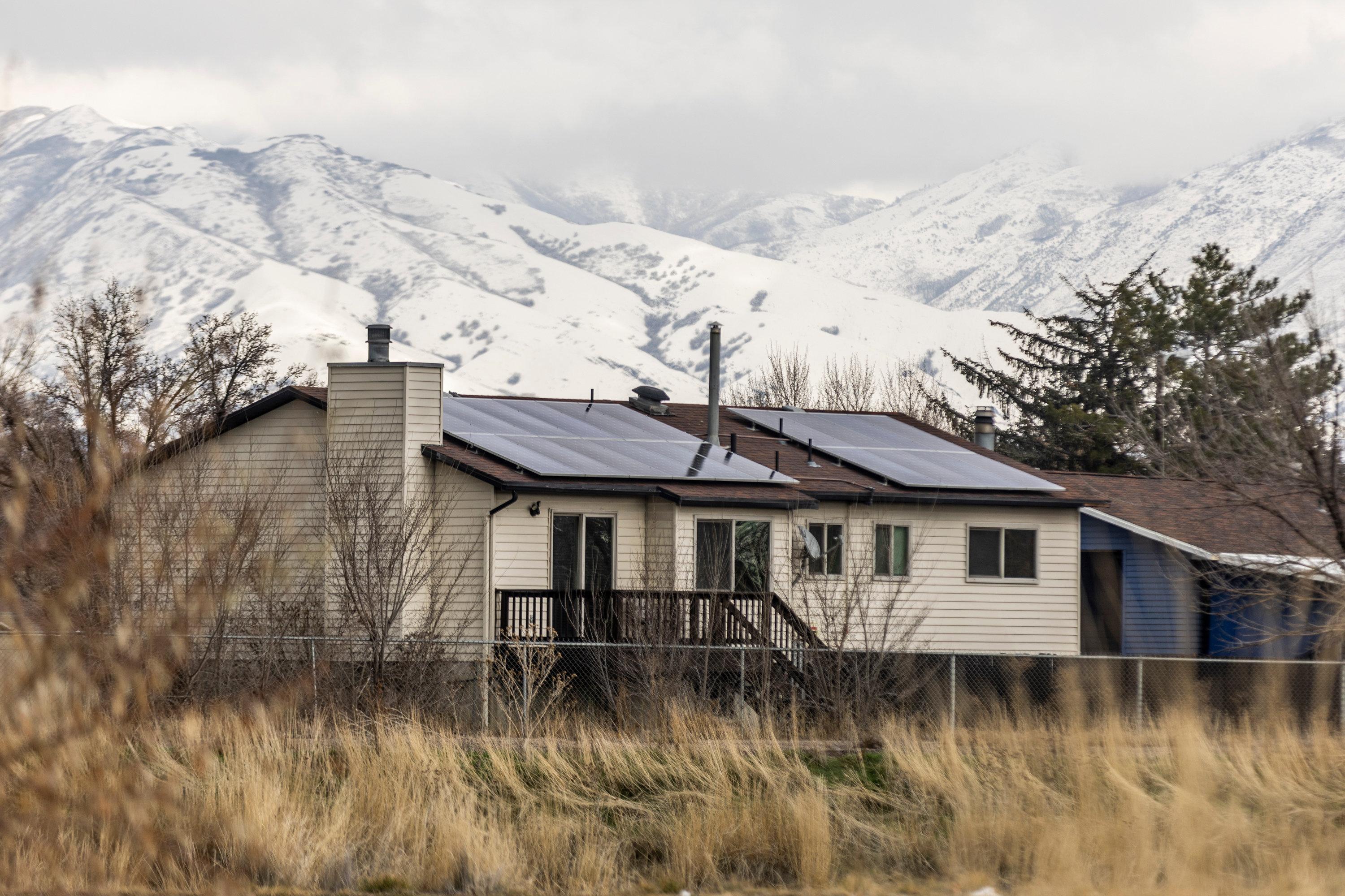 Solar panels are seen on roofs in Salt Lake City, on Feb. 8, 2024. Utah's solar industry is urging the Senate to reinstate energy tax credits that were cut in the House version of Trump's "big, beautiful" spending and budget bill.