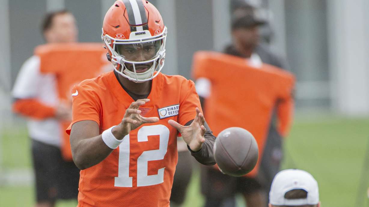 Cleveland Browns quarterback Shedeur Sanders takes a snap during an NFL football practice, Wednesday, May 28, 2025, in Berea, Ohio.
