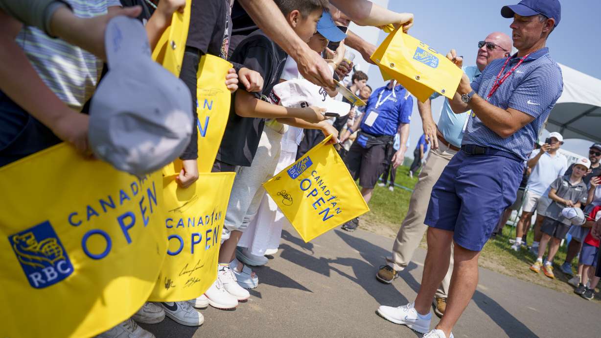 Rory McIlroy signs autographs for young fans during the pro-am at the Canadian Open Golf golf tournament, Wednesday, June 4, 2025, in Caledon, Ontario.