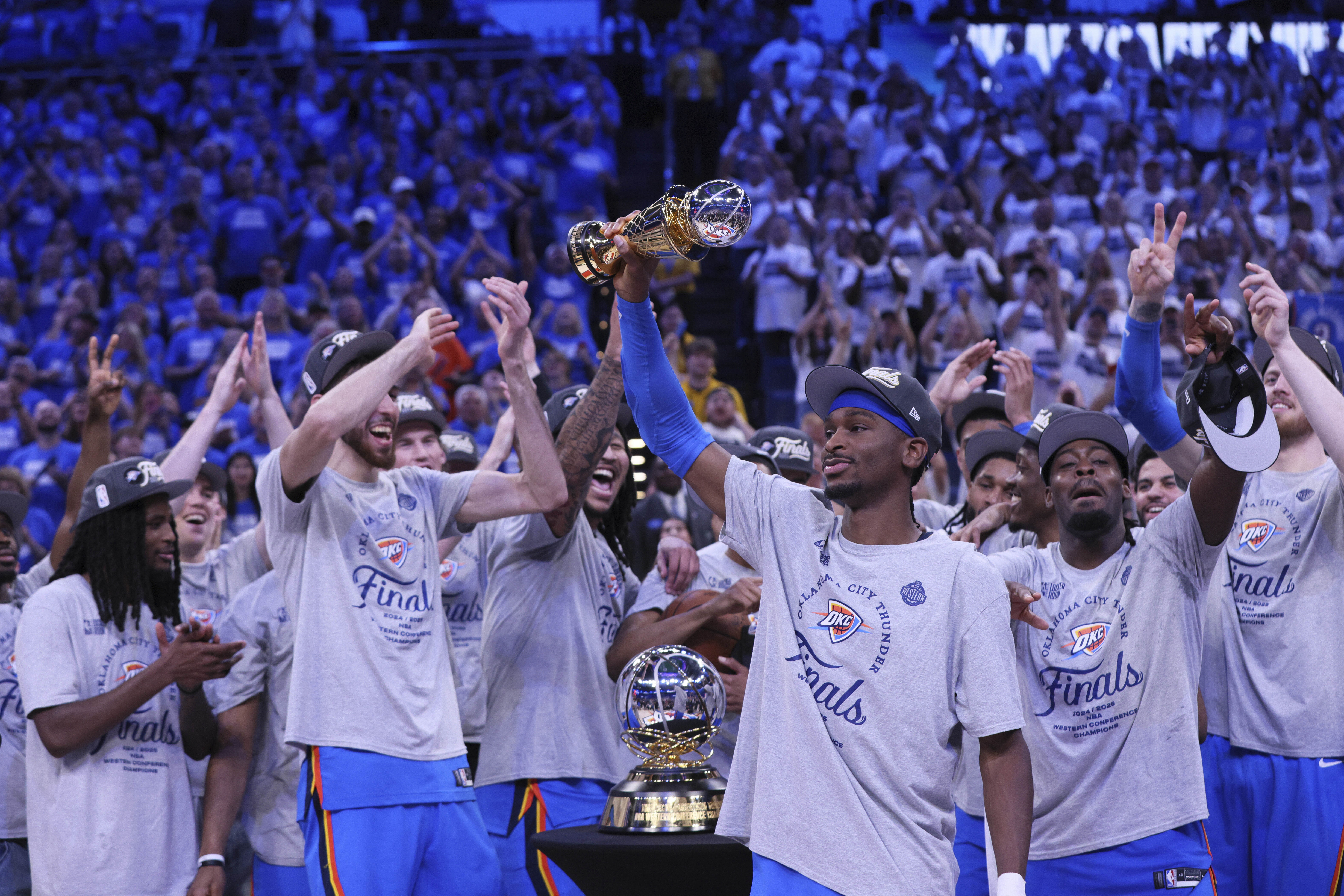 Oklahoma City Thunder guard Shai Gilgeous-Alexander (2), front, celebrates with teammates after Game 5 of the Western Conference finals of the NBA basketball playoffs against the Minnesota Timberwolves, Wednesday, May 28, 2025, in Oklahoma City. 