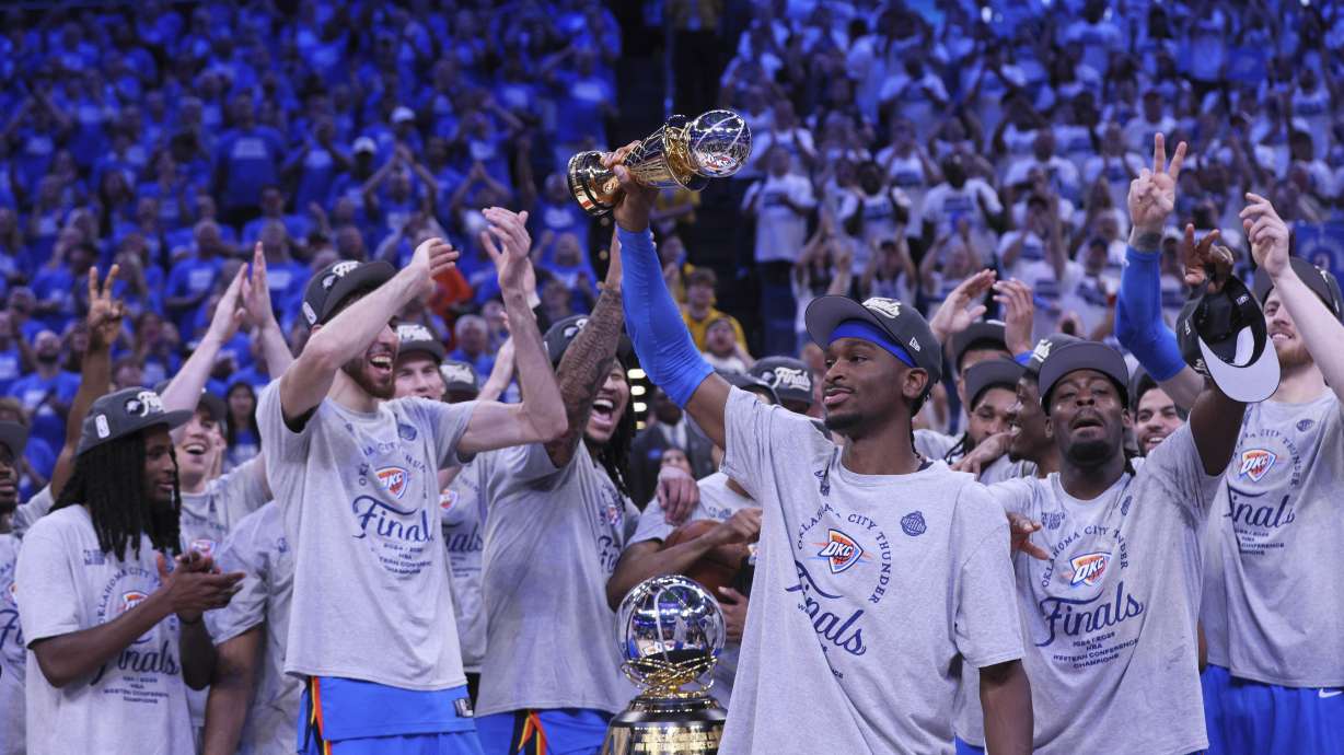 Oklahoma City Thunder guard Shai Gilgeous-Alexander (2), front, celebrates with teammates after Game 5 of the Western Conference finals of the NBA basketball playoffs against the Minnesota Timberwolves, Wednesday, May 28, 2025, in Oklahoma City.