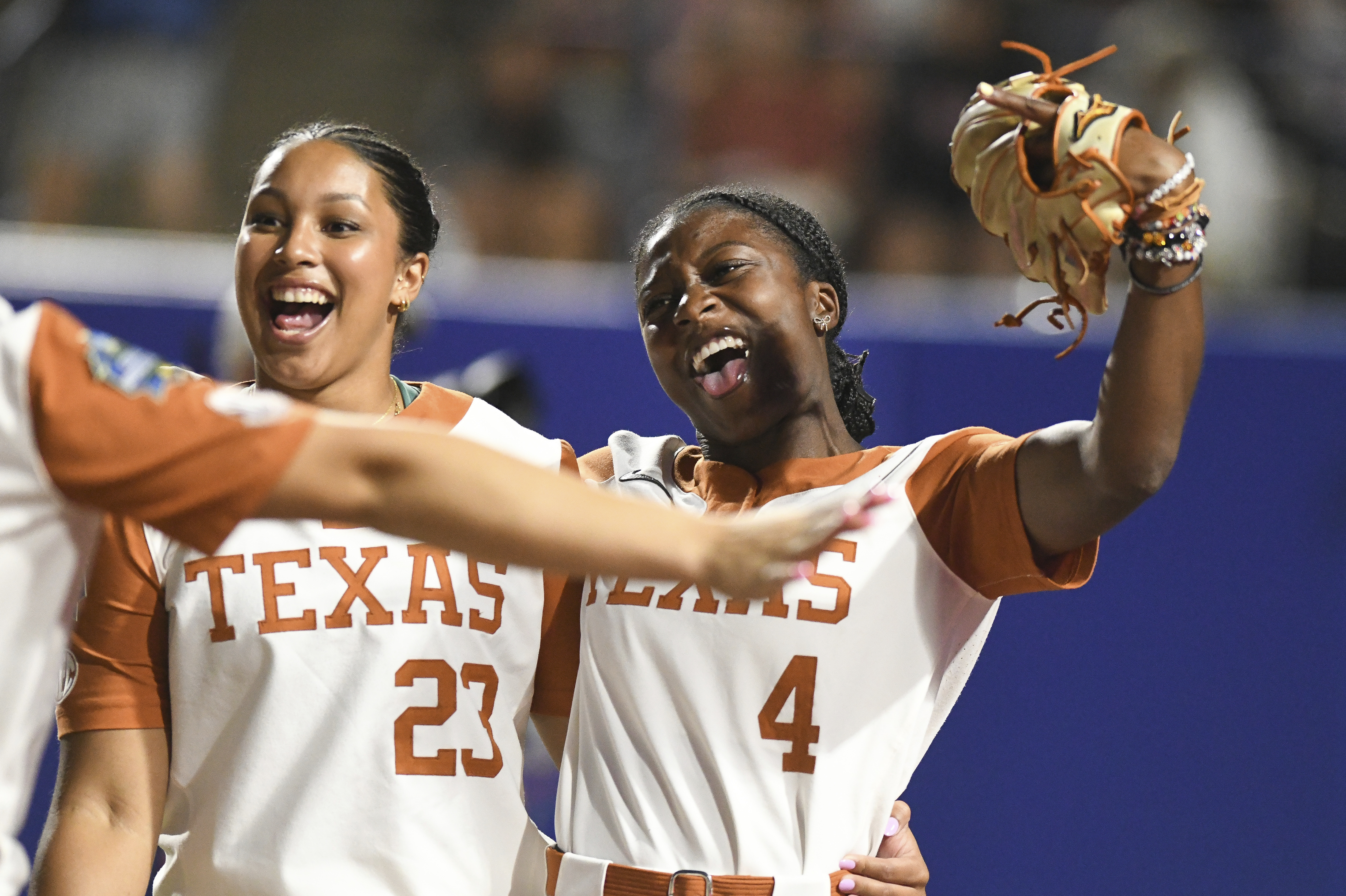 Texas infielder Viviana Martinez (23) and outfielder Adayah Wallace (4) celebrate after beating Texas Tech during the first game of the NCAA softball Women's College World Series finals in Oklahoma City, Wednesday, June 4, 2025.
