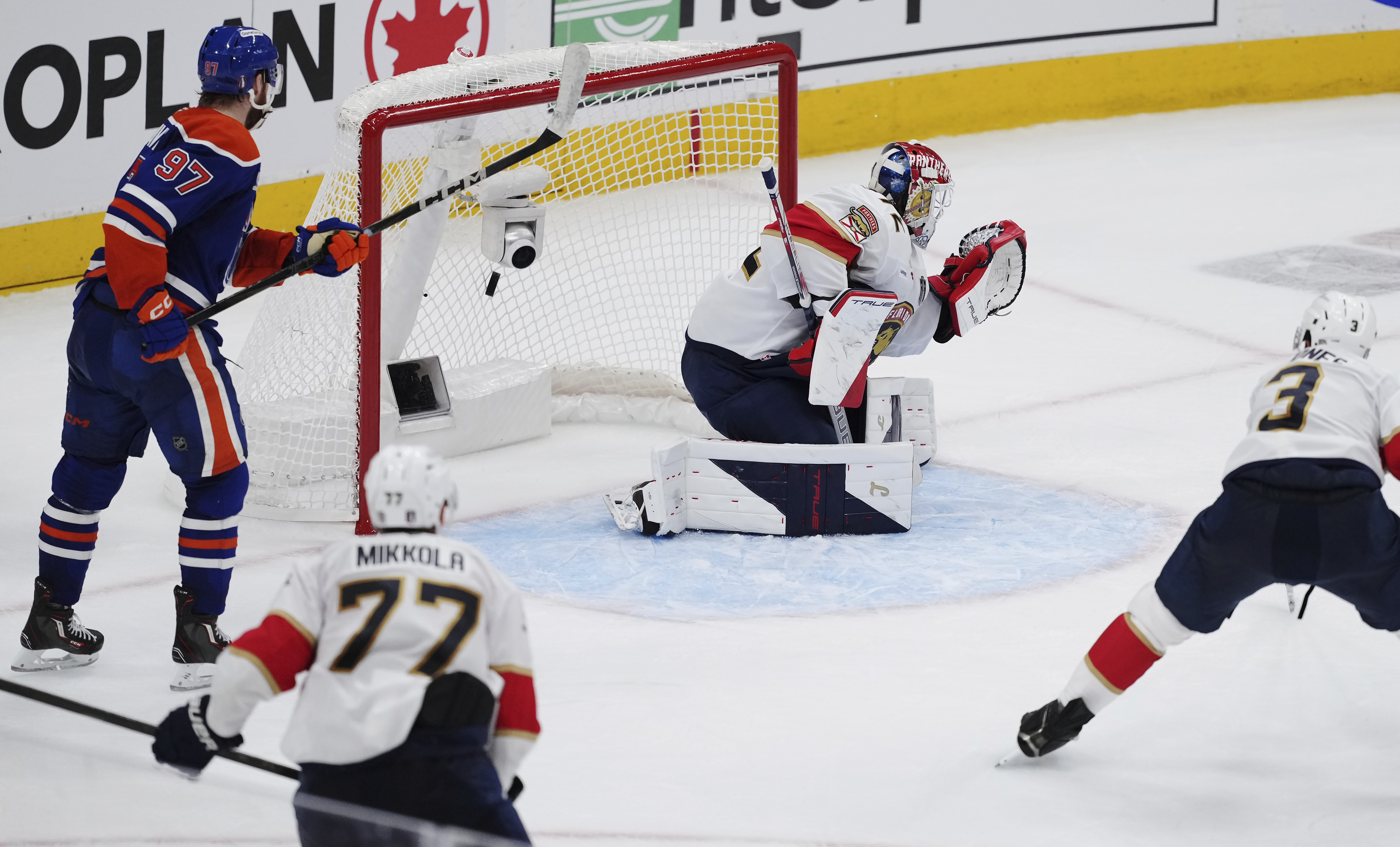 Edmonton Oilers' Leon Draisaitl (not shown) scores on Florida Panthers goalie Sergei Bobrovsky (72) as Oilers' Connor McDavid (97) looks on and Panthers' Seth Jones (3) defends during the first overtime period in Game 1 of the NHL Stanley Cup Final, in Edmonton, Alberta, on Wednesday, June 4, 2025. 