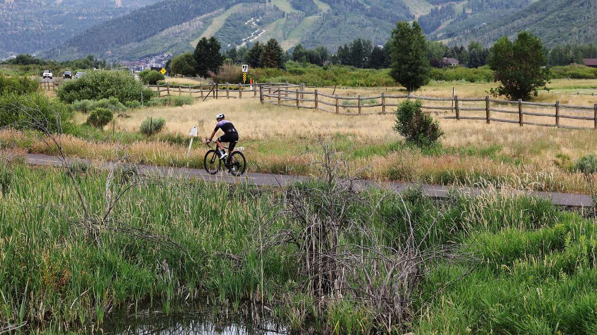 A biker rides on the trail in Park City on July 18, 2024. The Utah Department of Transportation is seeking public feedback on trail and road improvements along U.S. 40 in Wasatch and Summit counties.
