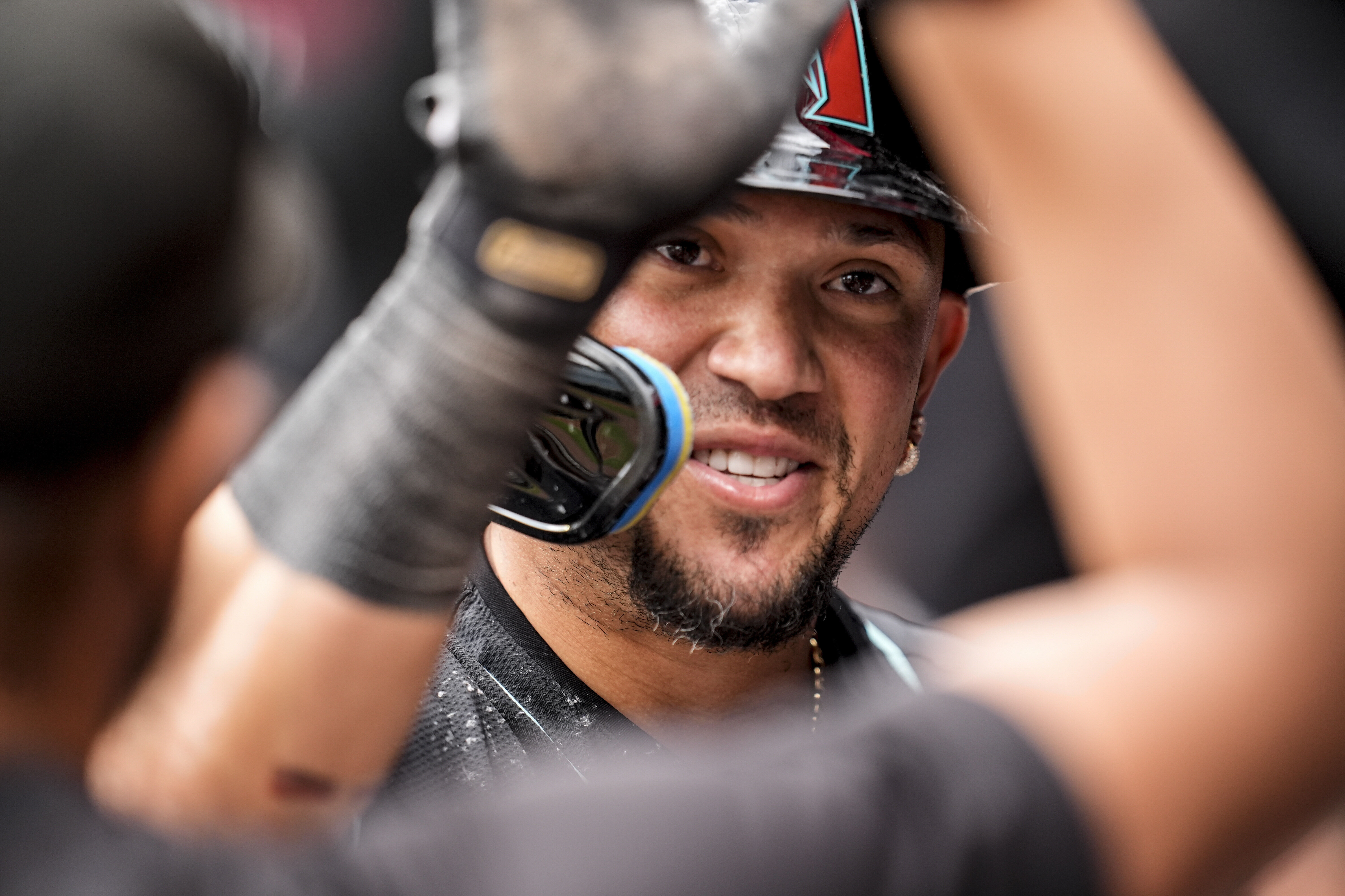 Arizona Diamondbacks second baseman Ildemaro Vargas (6) celebrates scoring in the ninth inning of a baseball game against the Atlanta Braves, Thursday, June 5, 2025, in Atlanta. 