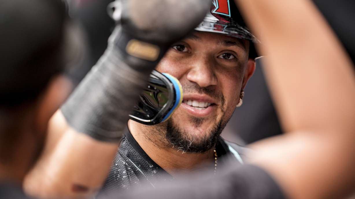Arizona Diamondbacks second baseman Ildemaro Vargas (6) celebrates scoring in the ninth inning of a baseball game against the Atlanta Braves, Thursday, June 5, 2025, in Atlanta.