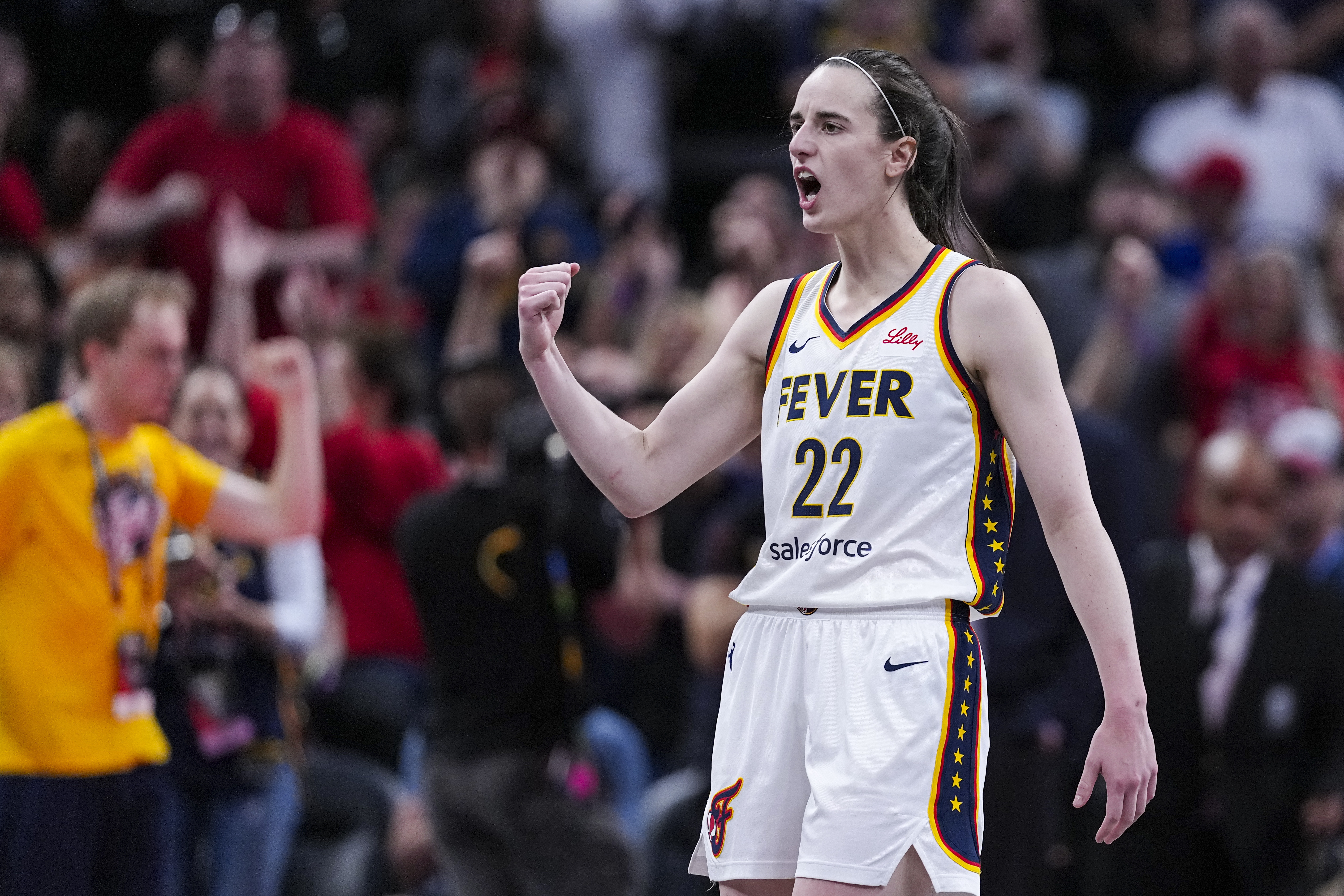 Indiana Fever guard Caitlin Clark (22) reacts after a basket against the New York Liberty in the second half of a WNBA basketball game in Indianapolis, Saturday, May 24, 2025. 