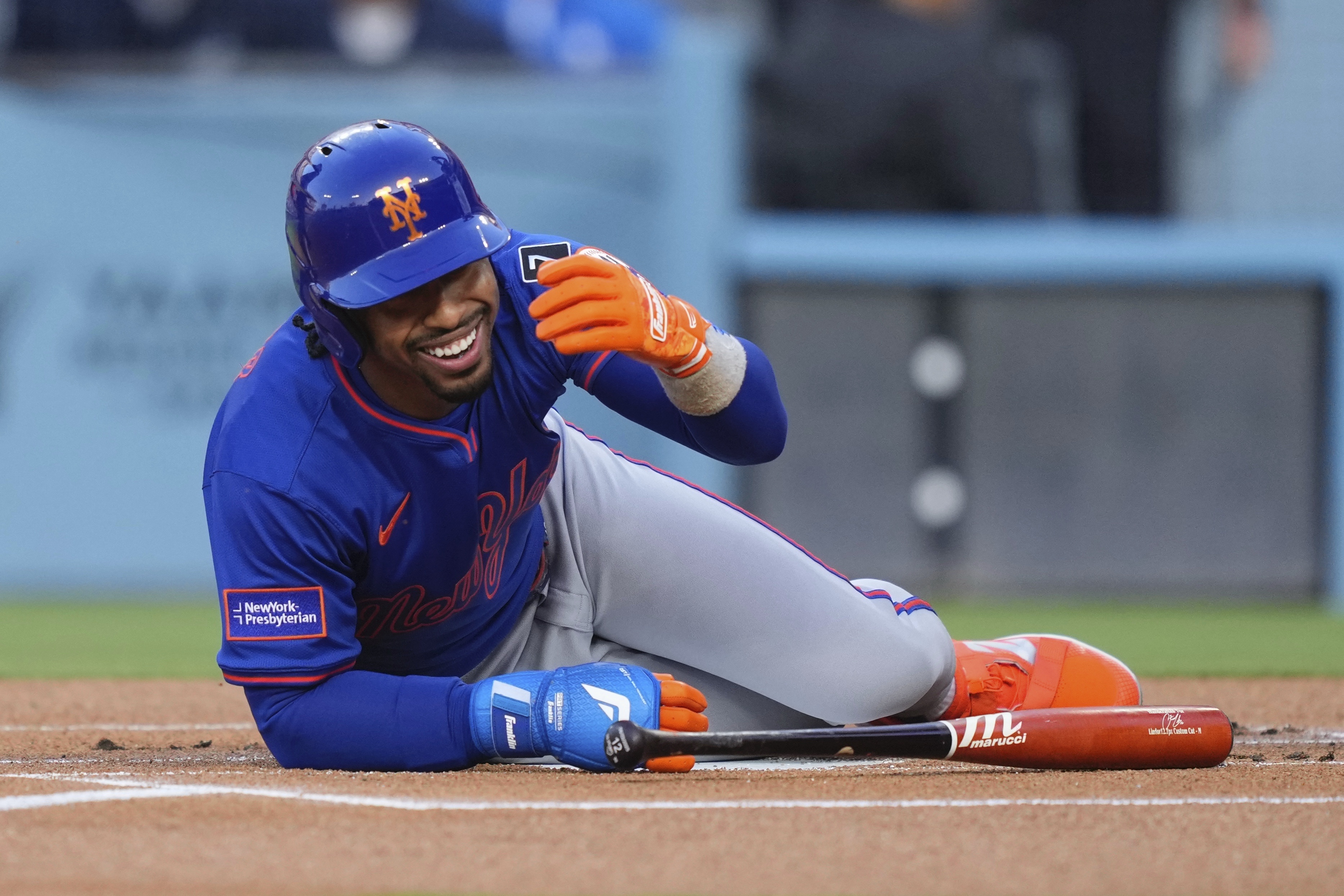 New York Mets' Francisco Lindor reacts toward the Los Angeles Dodgers' dugout after being hit with a pitch during the first inning of a baseball game Wednesday, June 4, 2025, in Los Angeles. 