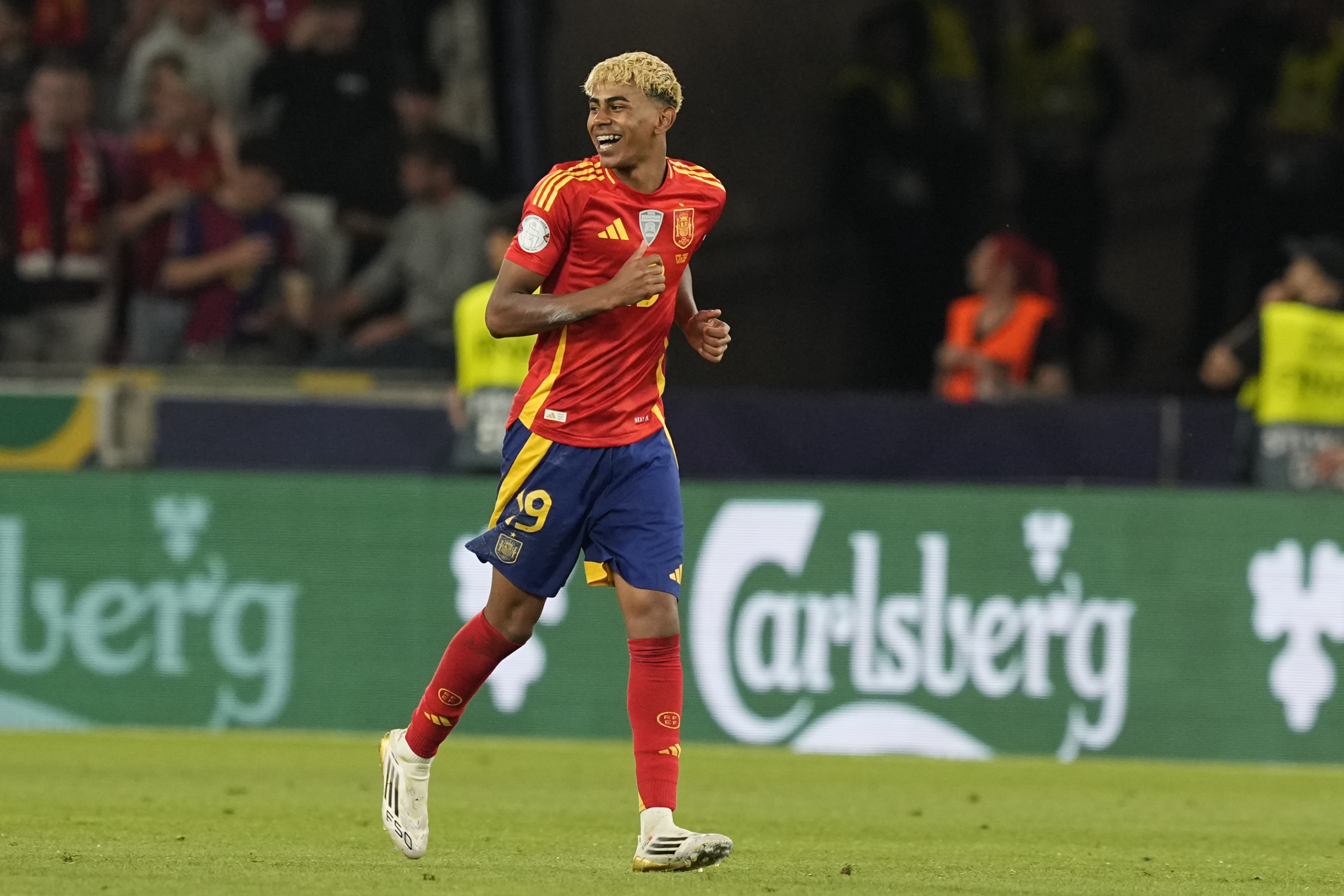 Spain's Lamine Yamal celebrates after scoring his side's third goal against France during the Nations League semifinal soccer match between Spain and France at the MHPArena, in Stuttgart, Germany, Thursday, June 5, 2025. 