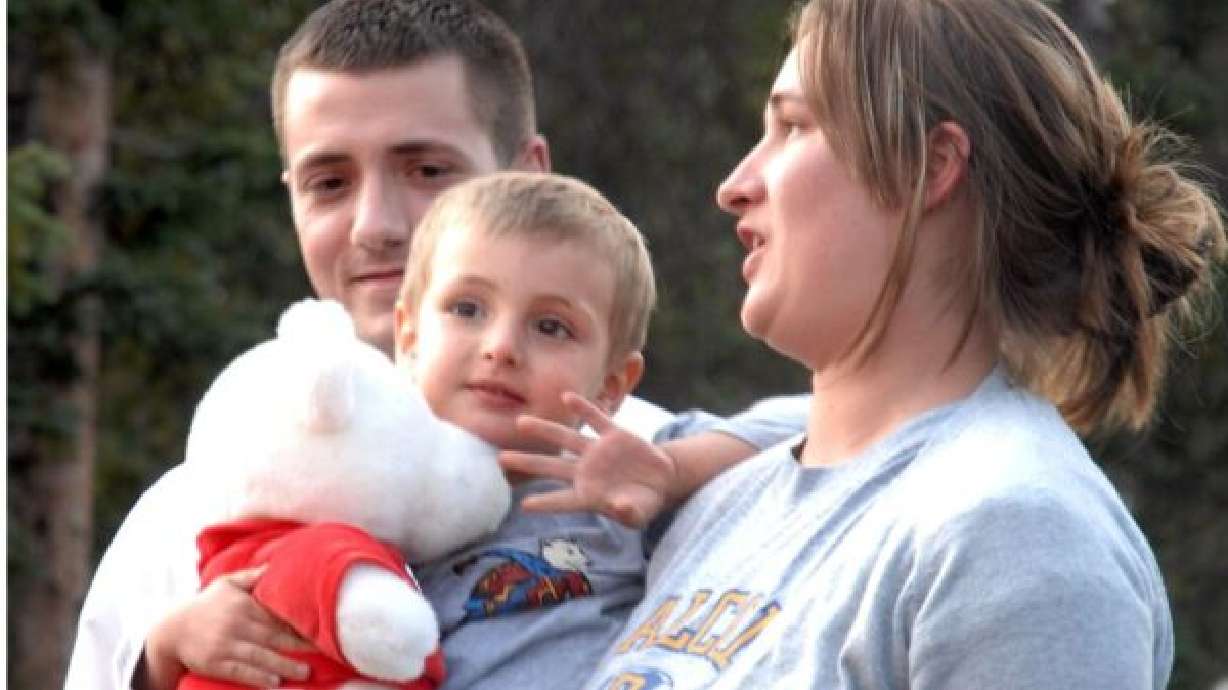 Naomi Jacobs holds her 3-year-old son, Benjamin Myrup, as she and his father, Mathew Myrup, talk to reporters shortly after Benjamin was found by search and rescue crews in September 2007. Their story shows how minutes matter when a person goes missing in the mountains.