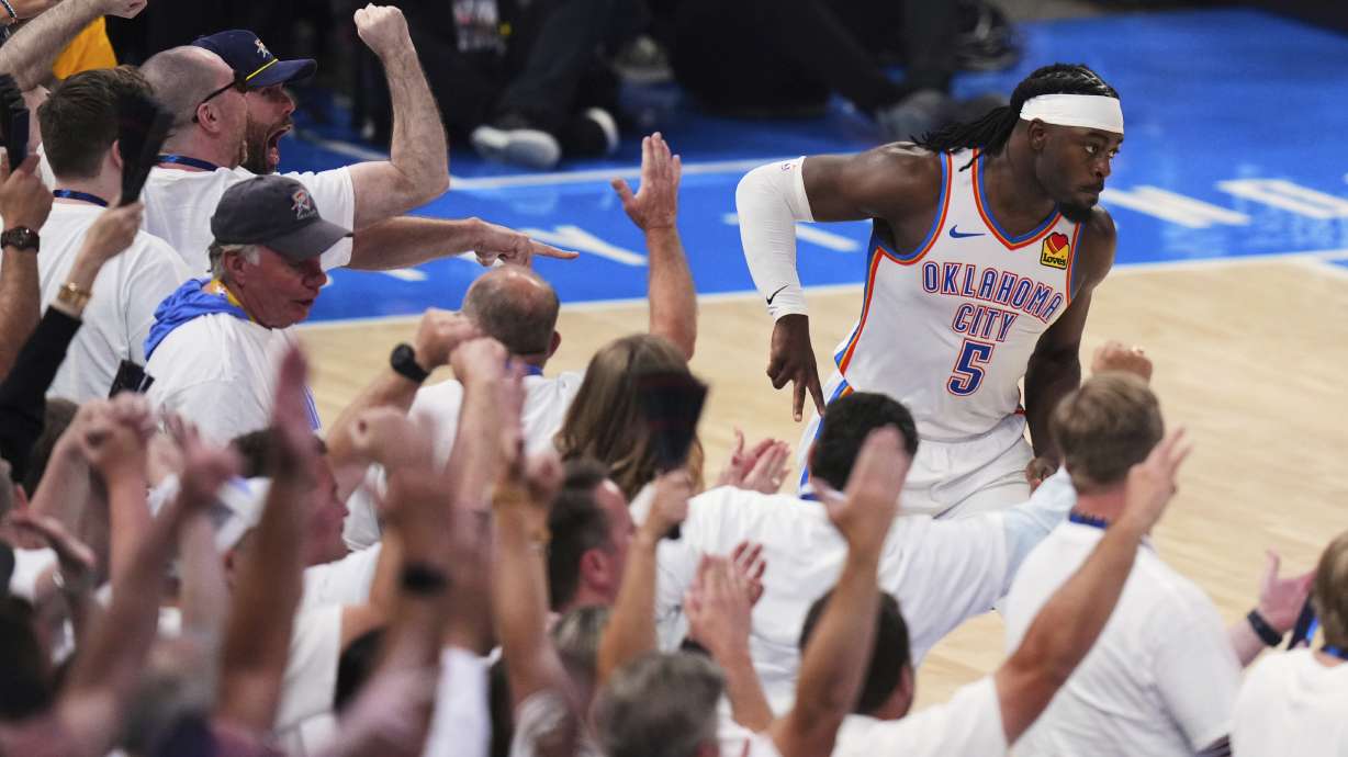 Oklahoma City Thunder guard Luguentz Dort (5) celebrates after making a 3-pointer during the first half of Game 1 of the NBA Finals basketball series against the Indiana Pacers Thursday, June 5, 2025, in Oklahoma City.