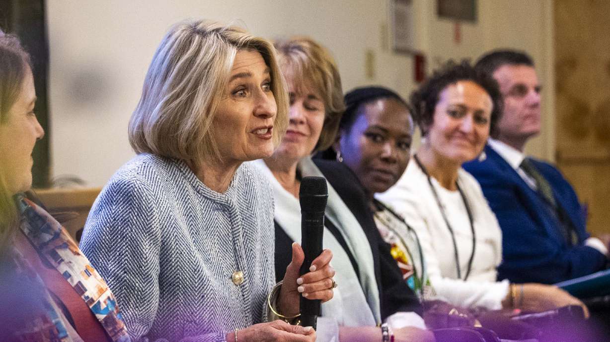 President Camille N. Johnson, Relief Society general president of The Church of Jesus Christ of Latter-day Saints, answers a question during a panel discussion with church leaders and representatives from humanitarian organizations Thursday.