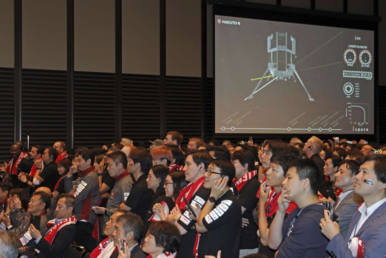 People await an update on ispace's private lunar lander Friday in Tokyo. The company's lander later crashed into the moon.