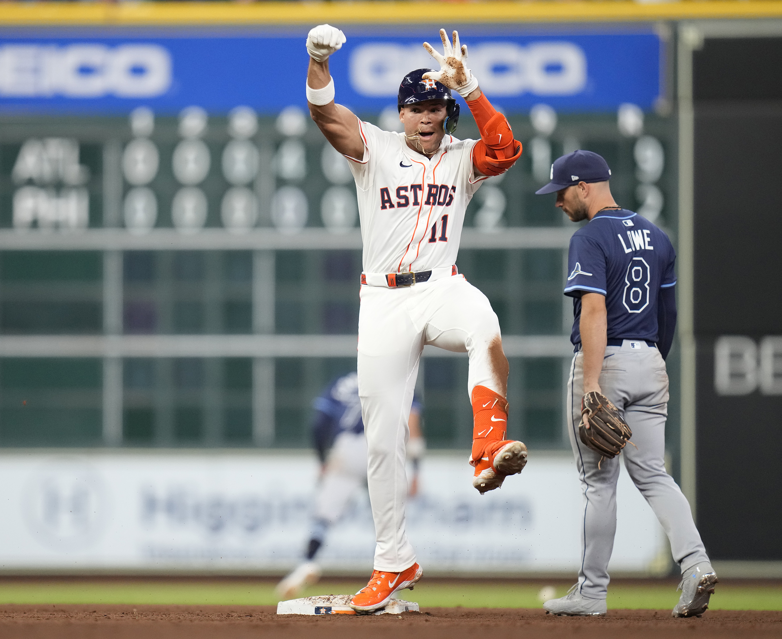 Houston Astros' Cam Smith (11) celebrates his double against Tampa Bay Rays starting pitcher Shane Baz during the fifth inning of a baseball game, Thursday, May 29, 2025, in Houston. 