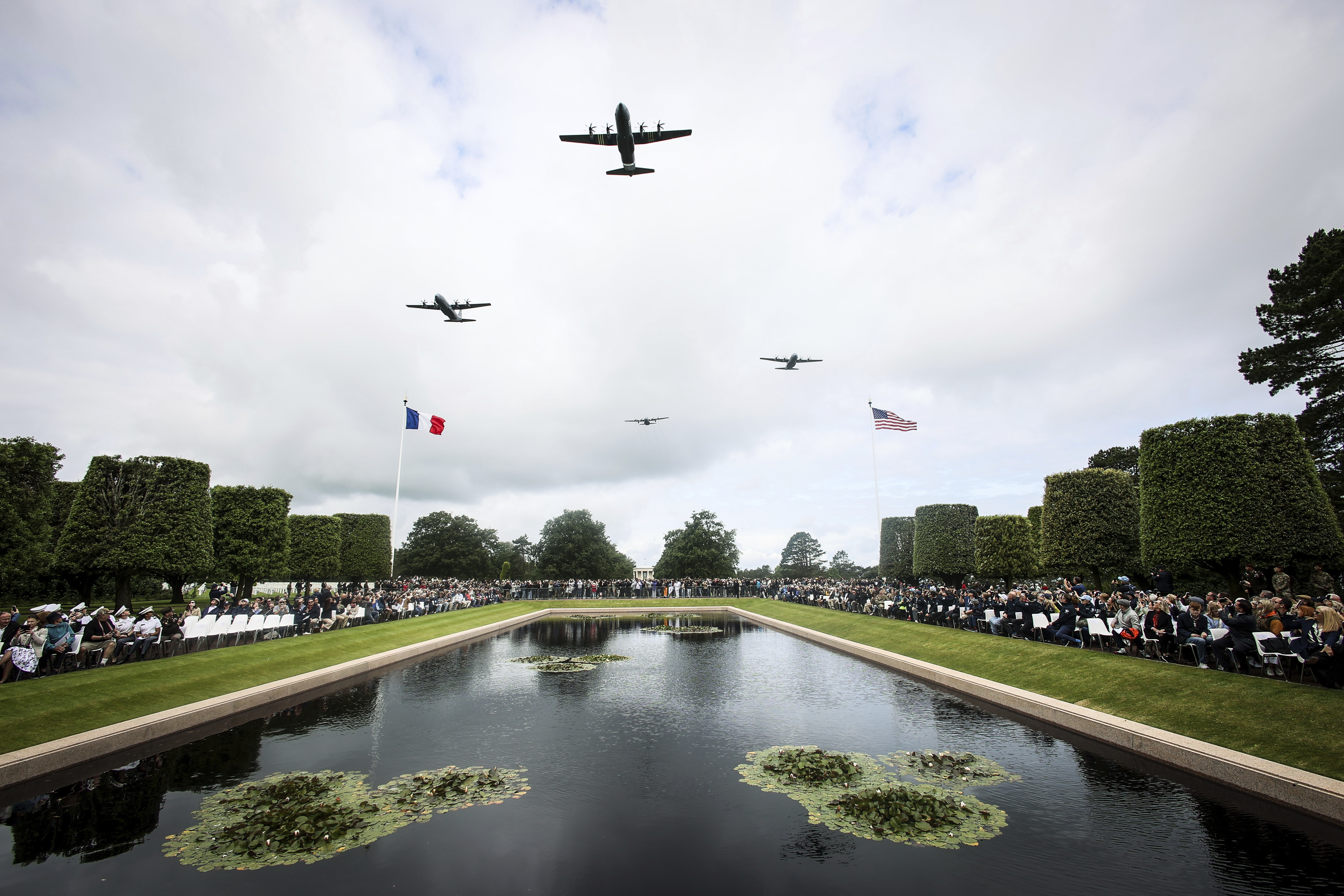 War planes fly over the US cemetery during a ceremony to commemorate the 81st anniversary of the D-Day landings, Friday, in Colleville-sur-Mer, Normandy, France.