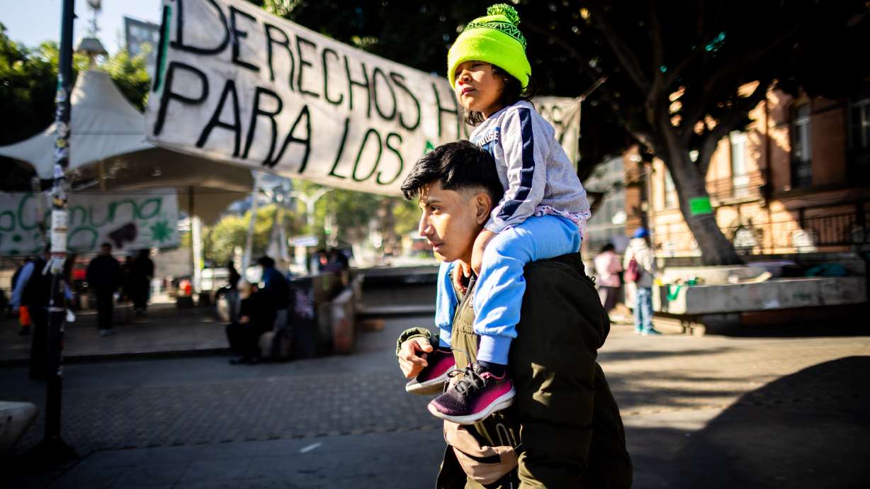 Guatemalan migrant Eduardo Aldana, 20, and daughter Fernanda Archila, 4, walk to the mobile coffee stand in Little L.A., a gathering spot for young Mexicans who grew up in the United States, in Mexico City on Feb. 8.